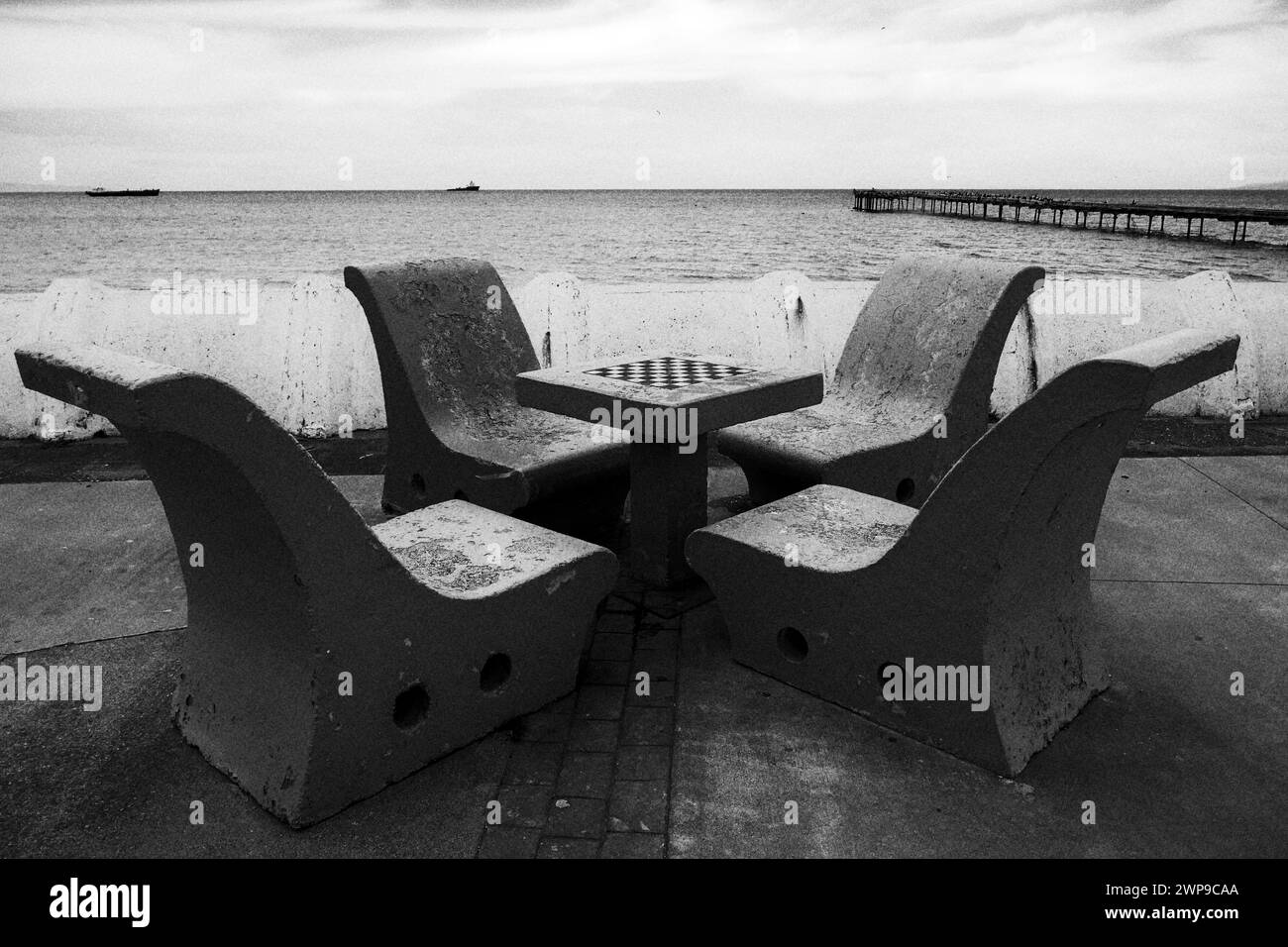 Seating outdoor chess on the sea front in Punta Arenas Stock Photo