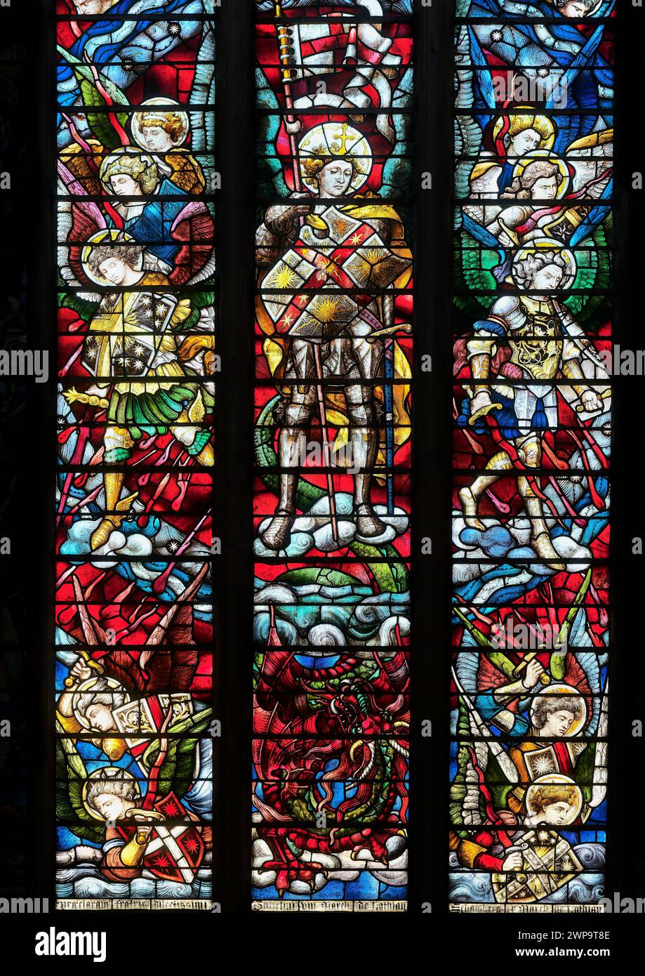 St Michael and the good angels drive out the devil and bad angels, illustration at Christ Church college cathedral, University of Oxford, England. Stock Photo