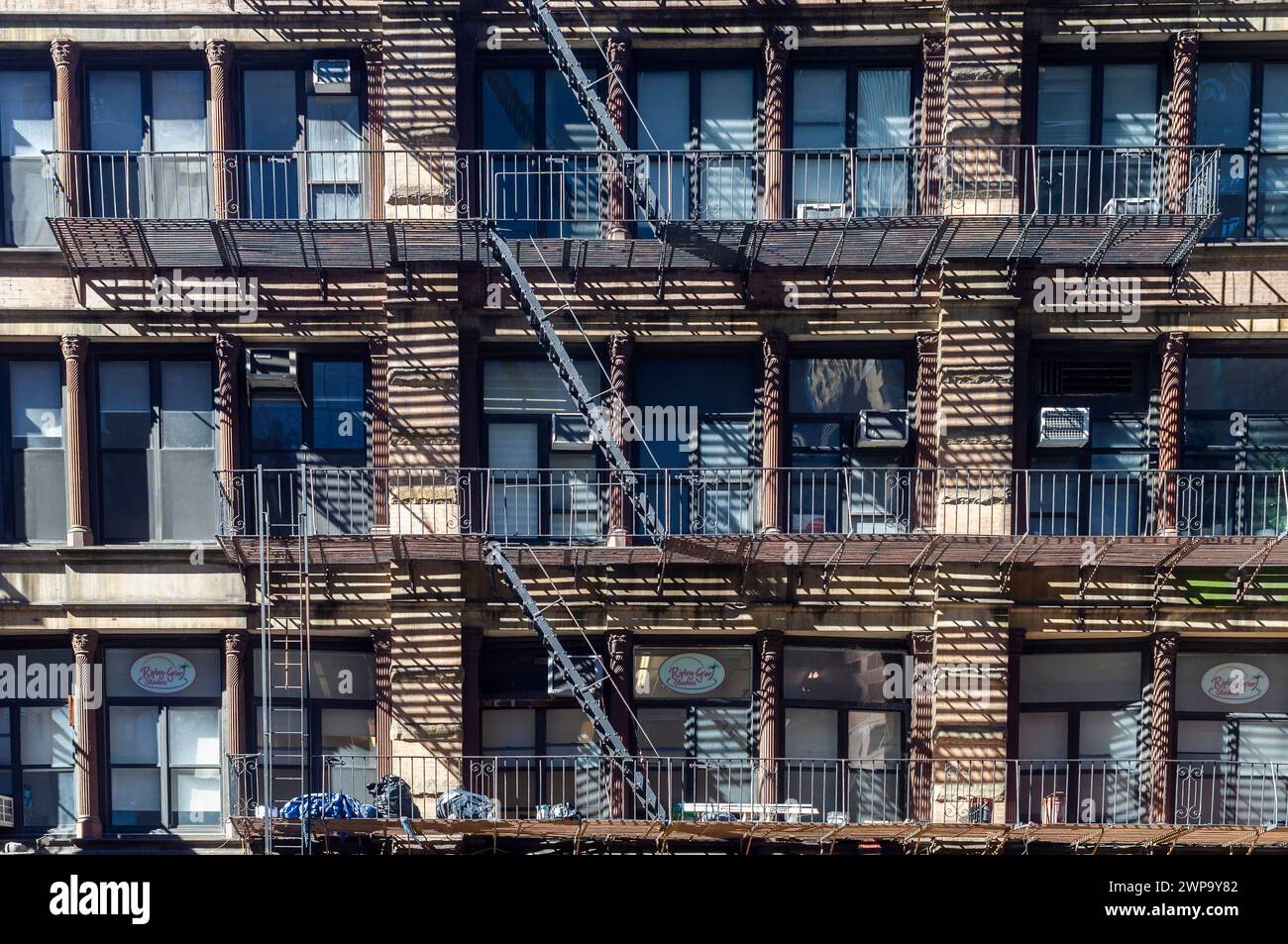 Fire escapes on a loft building in Midtown Manhattan in New York on Sunday, March 3, 2024 (© Richard B. Levine) Stock Photo