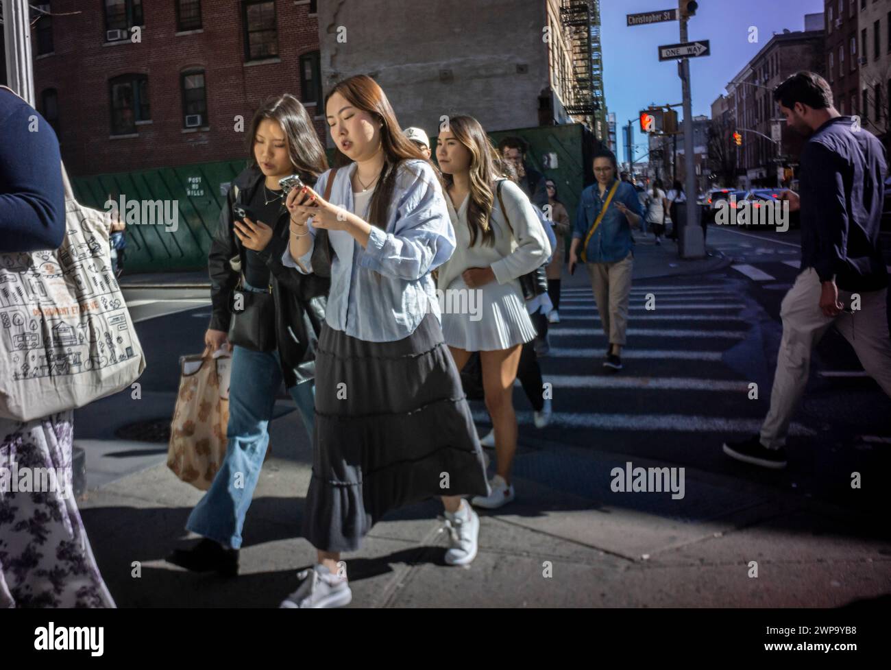 Shoppers take advantage of the warm weather to crowd trendy Bleecker