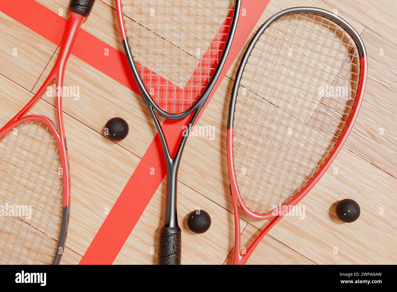 Squash rackets and balls lie on the floor of the sports court. Top view