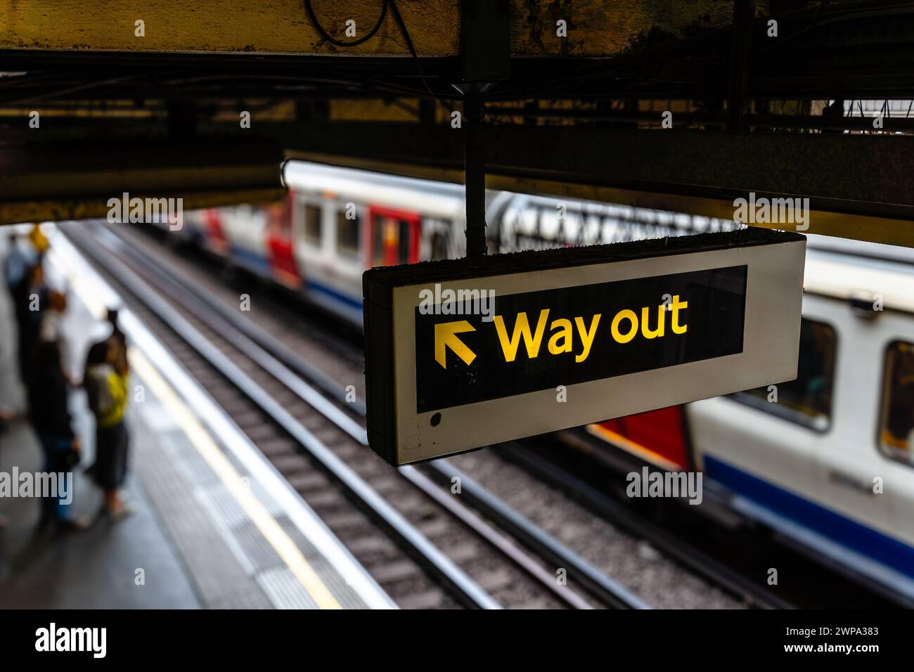 Way out signal in the subway against blurred background Stock Photo