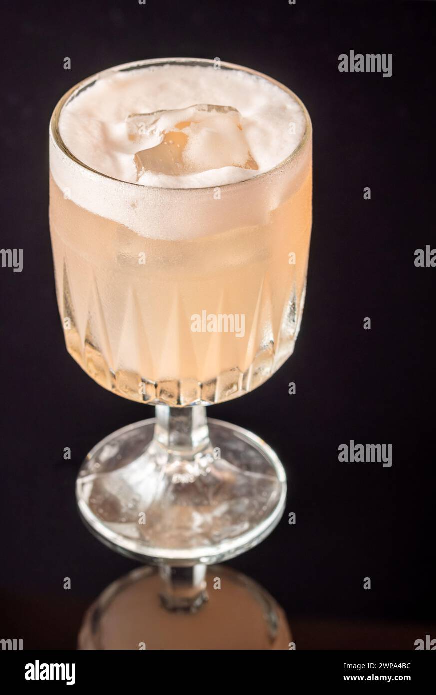 Goblet glass of Grapefruit tequila sour cocktail Stock Photo Alamy