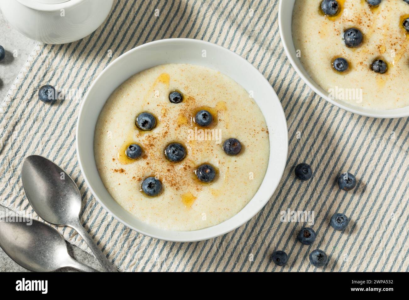 Traditional Healthy Breakfast Wheat Porridge with Honey and Berries Stock Photo