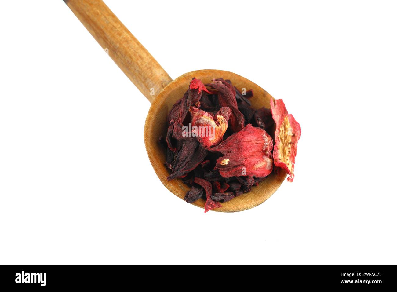 Karkade tea. Hibiscus tea leaves in wooden spoon isolated on white background. File contains clipping path. Top view. Stock Photo