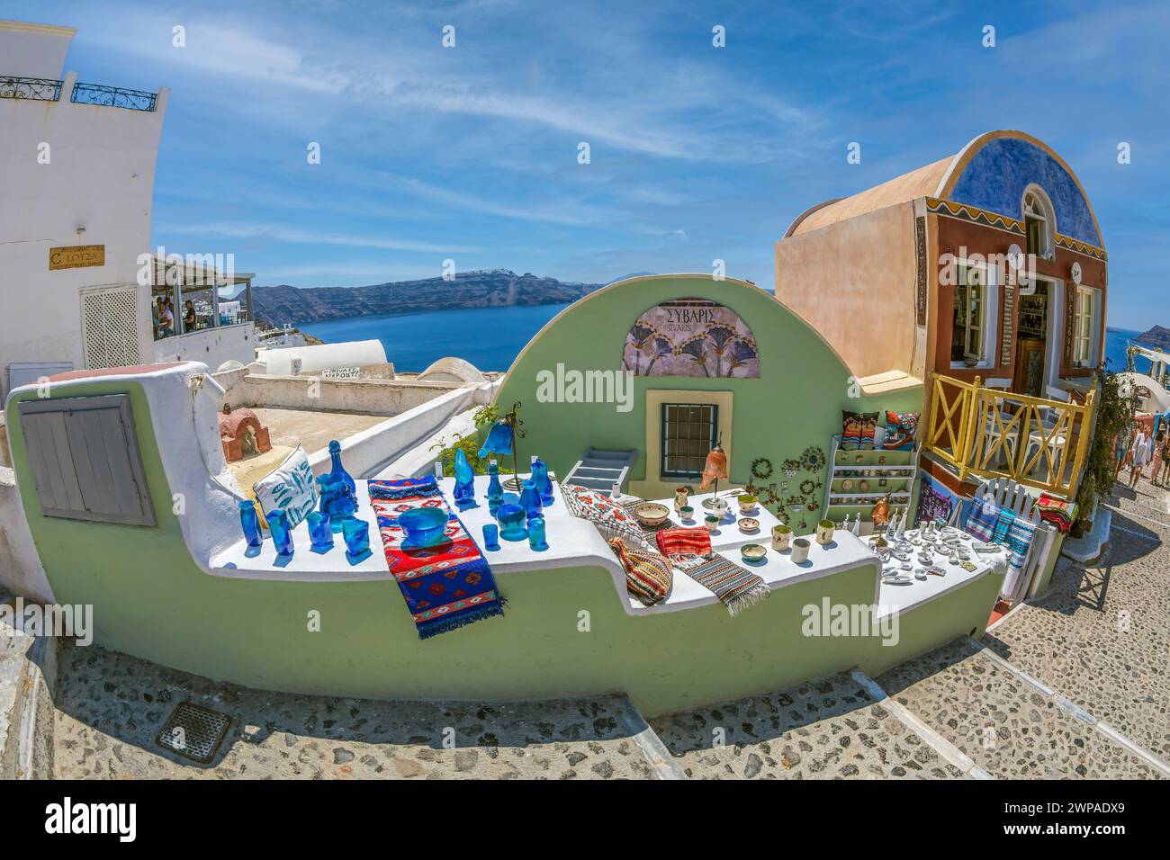 OIA, SANTORINI, GREECE - JUNE 21, 2021: Shop with typical souvenirs from Greece and Santorini island, located on Main Street Nik. Nomikou. Stock Photo