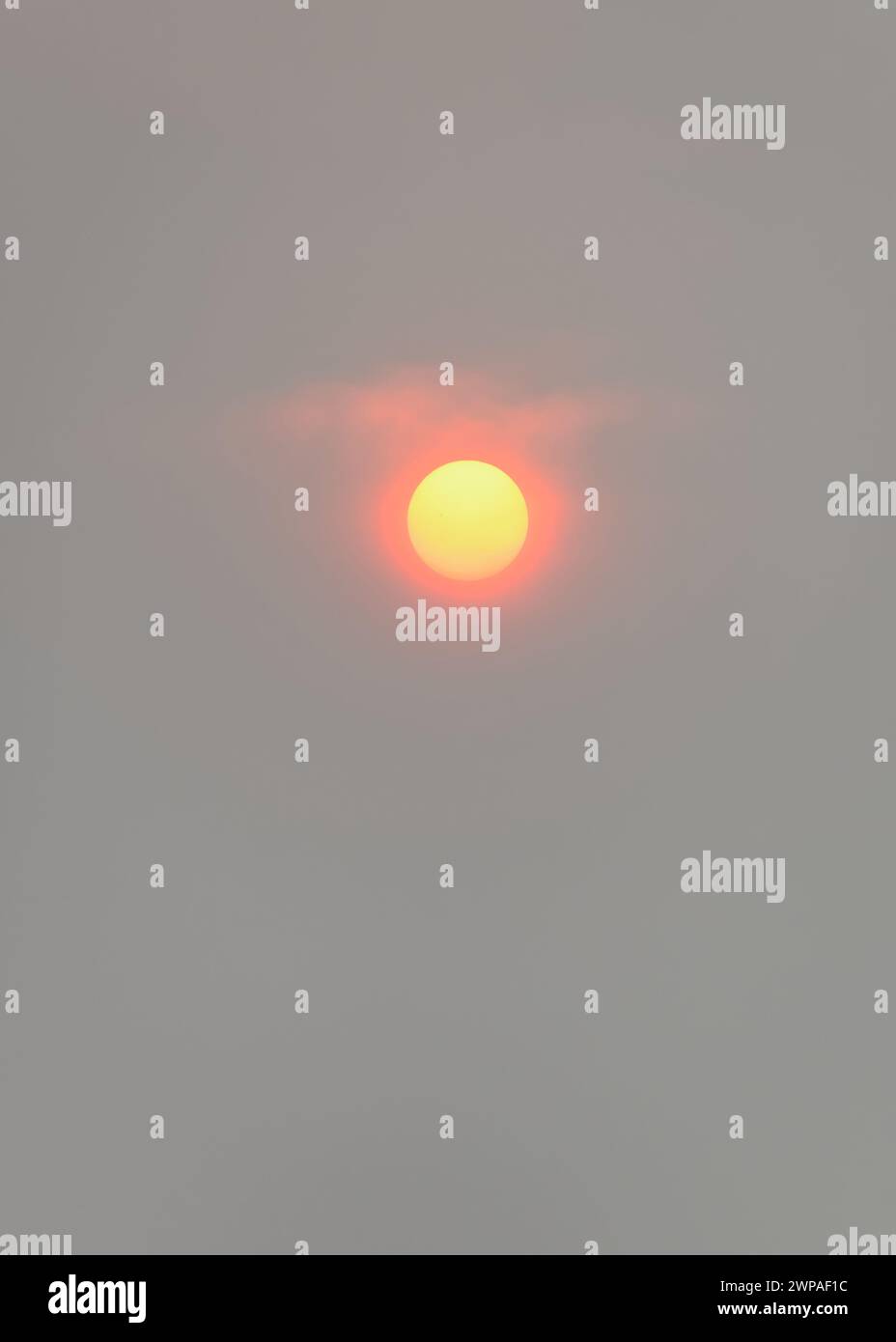 The sun almost blanketed from sight in Edmonton due to smoke from forest fires in north and west Alberta, Canada. Stock Photo