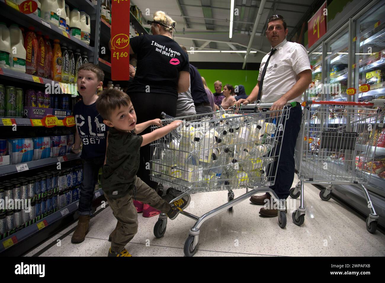 08/08/15  Full story here:  http://www.fstoppress.com/articles/milk protest uttoxeter/  Farmers and their families follow a coffin into Asda's Uttoxet Stock Photo