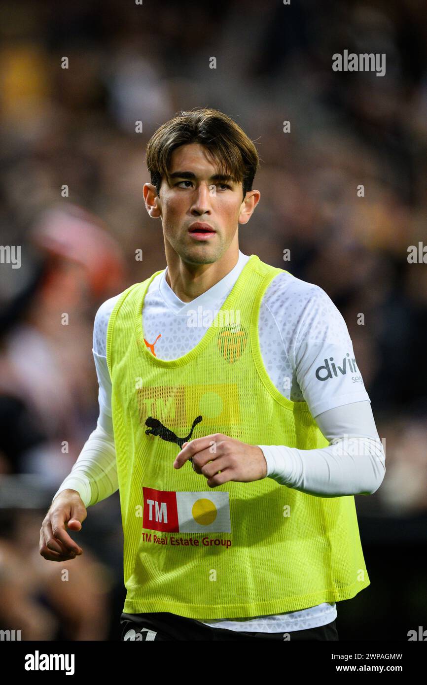 Portrait of the young player from Extremadura of Valencia Club de Futbol Jesús Vázquez warming up on the touchline during a match at Mestalla Stock Photo