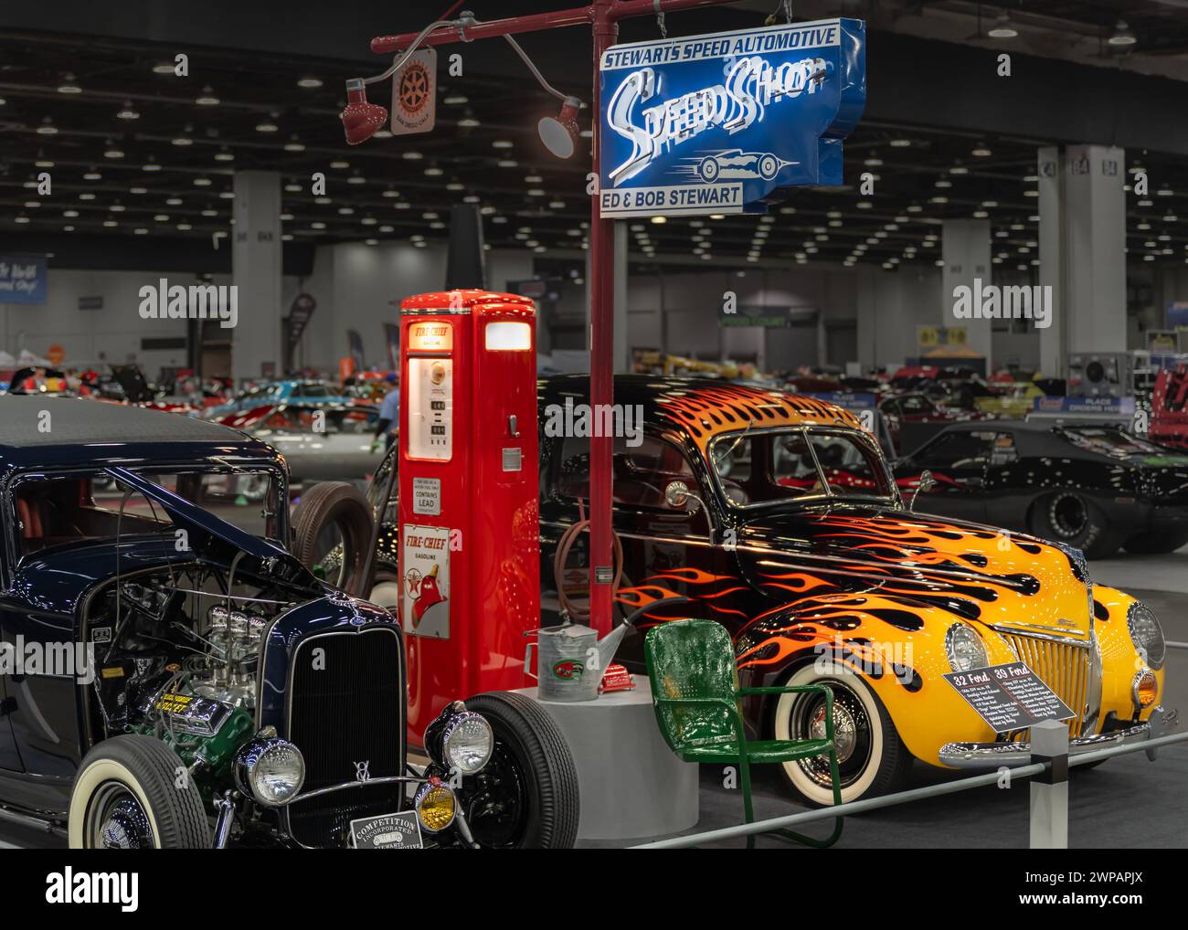 DETROIT, MI/USA - March 1, 2024: at Detroit AutoRama. 1932 and 1939 Ford hot rod cars at parked at a Speed Shop gas pump, at Detroit AutoRama. Stock Photo