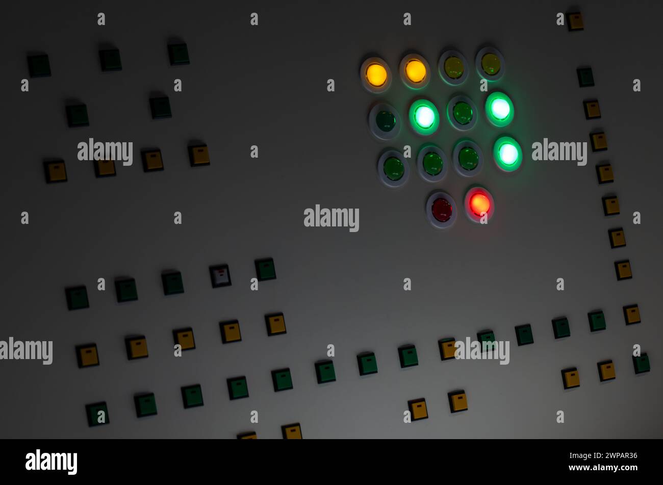 Industrial control panel with illuminated buttons glowing with ...