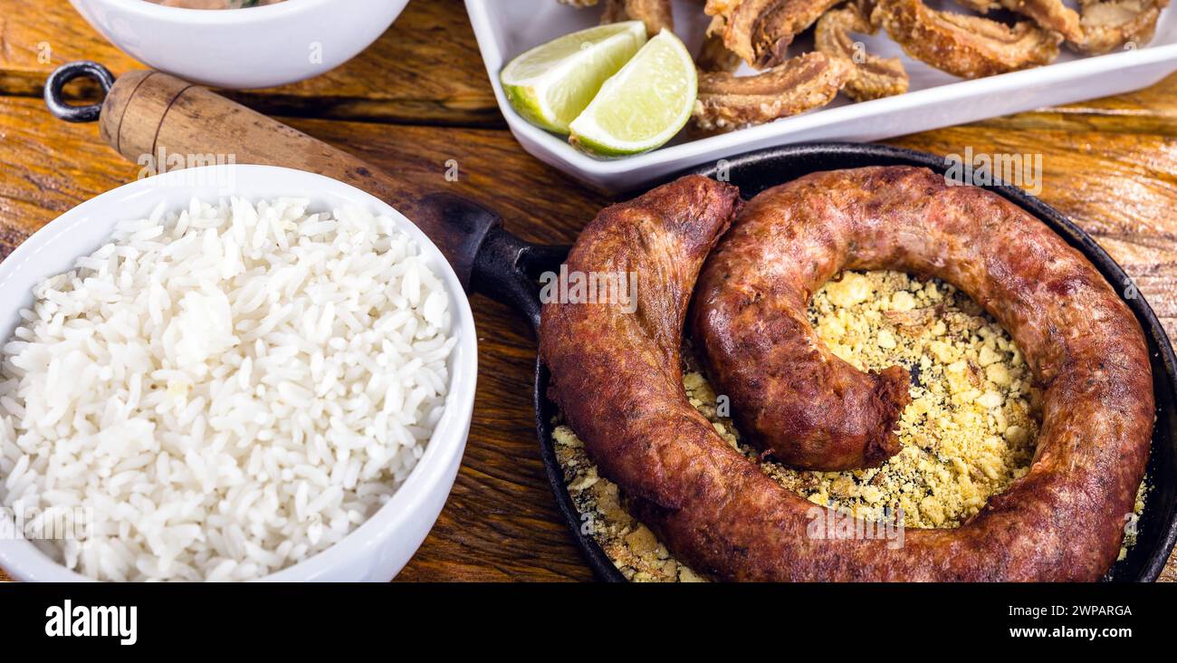 Typical food table in the interior of Brazil. Pork, beans, bean tutu