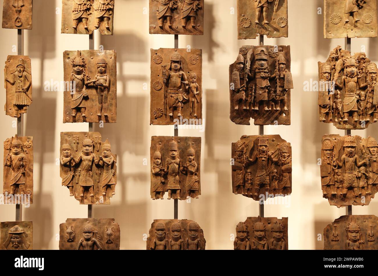 The Benin Bronzes, plaques made in the West African Kingdom of Benin 1550-1650,  to decorate the Oba's palace. The British attacked Benin City in 1897. Stock Photo