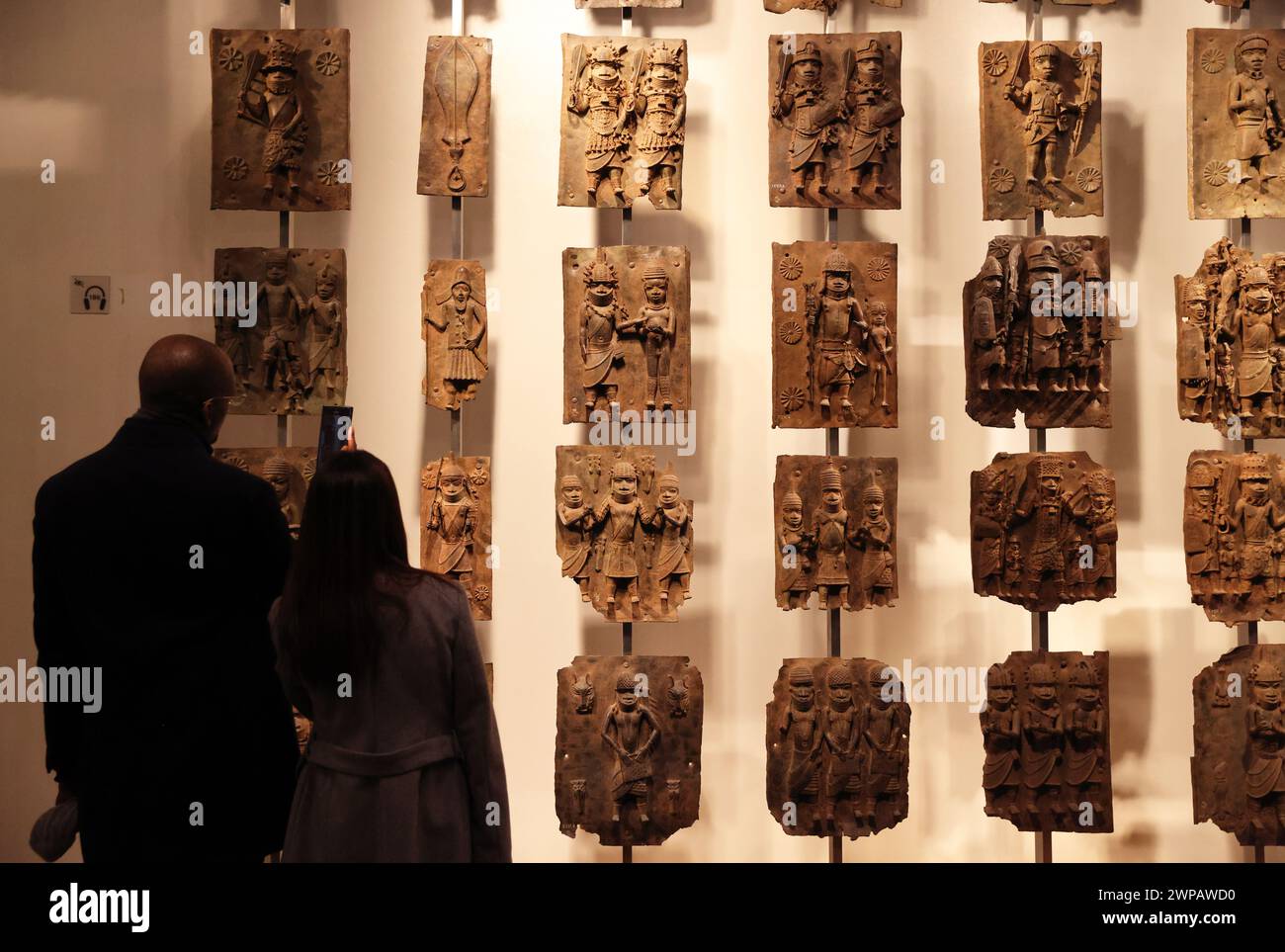 The Benin Bronzes, plaques made in the West African Kingdom of Benin 1550-1650,  to decorate the Oba's palace. The British attacked Benin City in 1897. Stock Photo