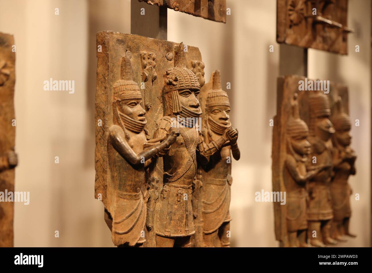 The Benin Bronzes, plaques made in the West African Kingdom of Benin 1550-1650,  to decorate the Oba's palace. The British attacked Benin City in 1897. Stock Photo
