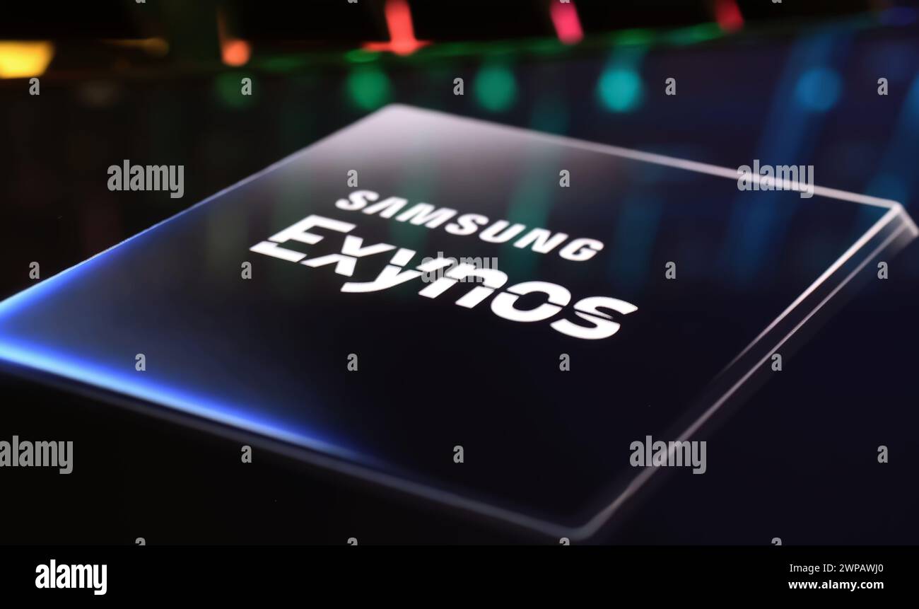 Viersen, Germany - March 1. 2024: Closeup of smartphone screen with logo lettering of Samsung Exynos processor chip on computer keyboard Stock Photo