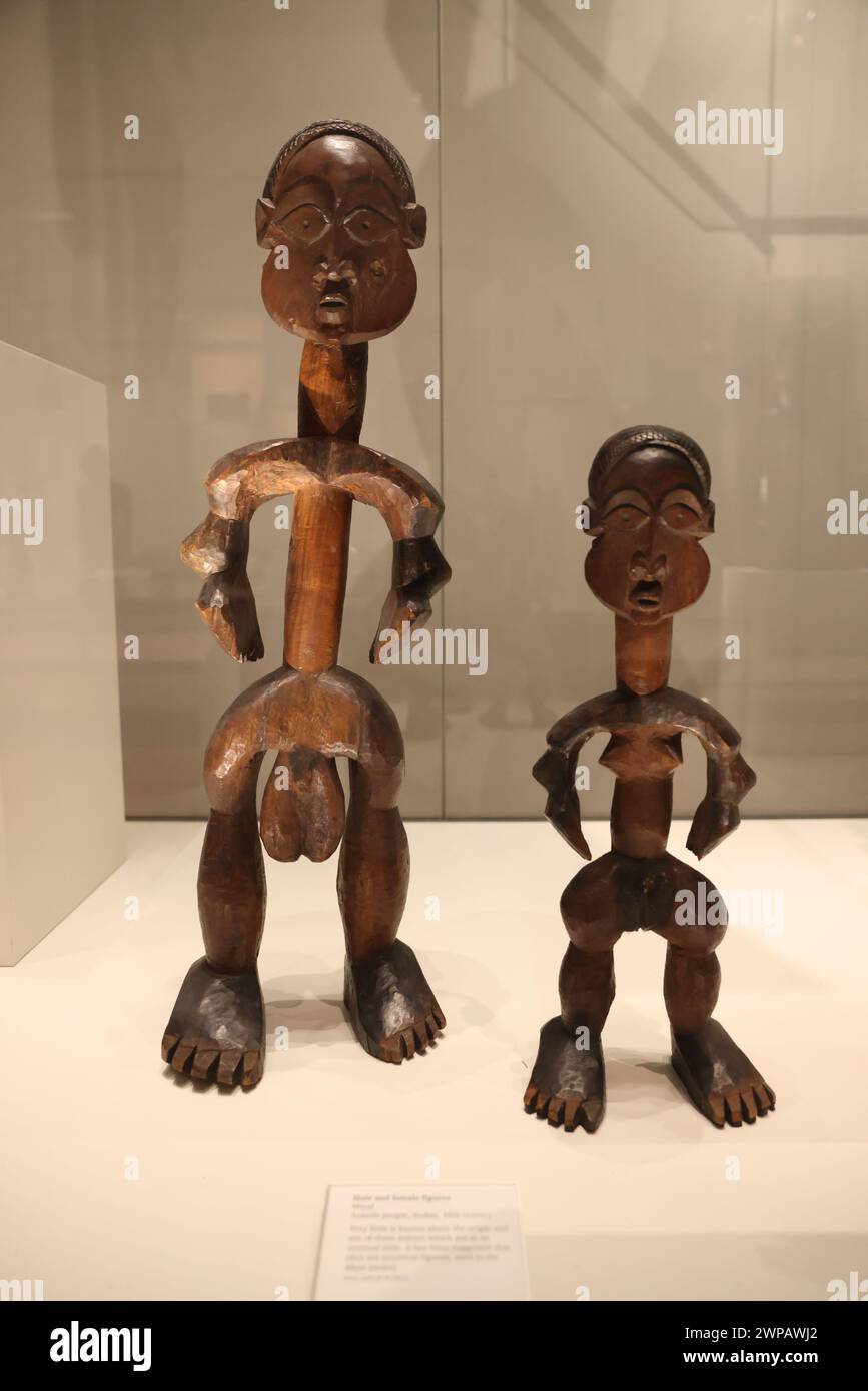 Male & female wooden figures, from the Azande people, in Sudan in the 19th century, they are thought to be ancestral figures used in the Mani Society. Stock Photo
