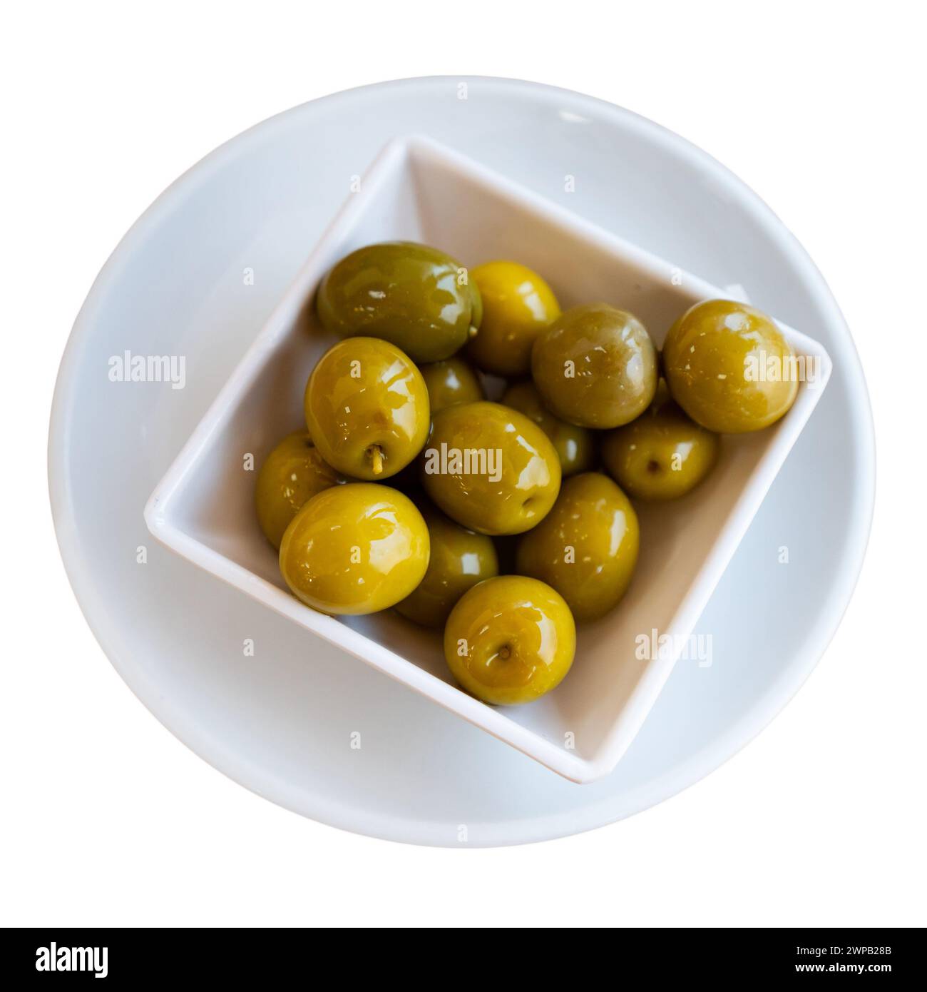 Green olives with pits served in bowl Stock Photo Alamy