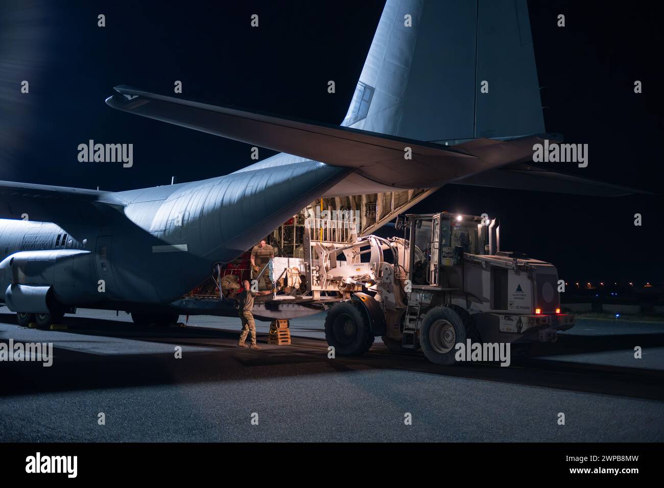 Azraq, Jordan. 05th Mar, 2024. U.S. Army soldiers loads pallets of humanitarian aid in the cargo bay of a U.S. Air Force C-130J Super Hercules aircraft at Muwaffaq Salti Air Base, March 5, 2024 in Azraq, Zarqa Governorate, Jordan. The food aid will be airdropped to Palestinian refugees trapped by the Israeli war against Hamas. Credit: SrA Lauren Jacoby/US Airforce Photo/Alamy Live News Stock Photo