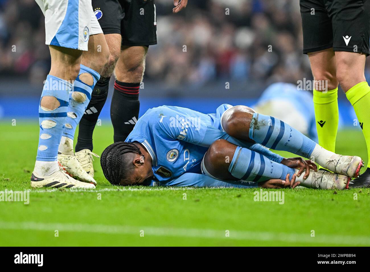 Manuel Akanji of Manchester City goes down with an injury during the