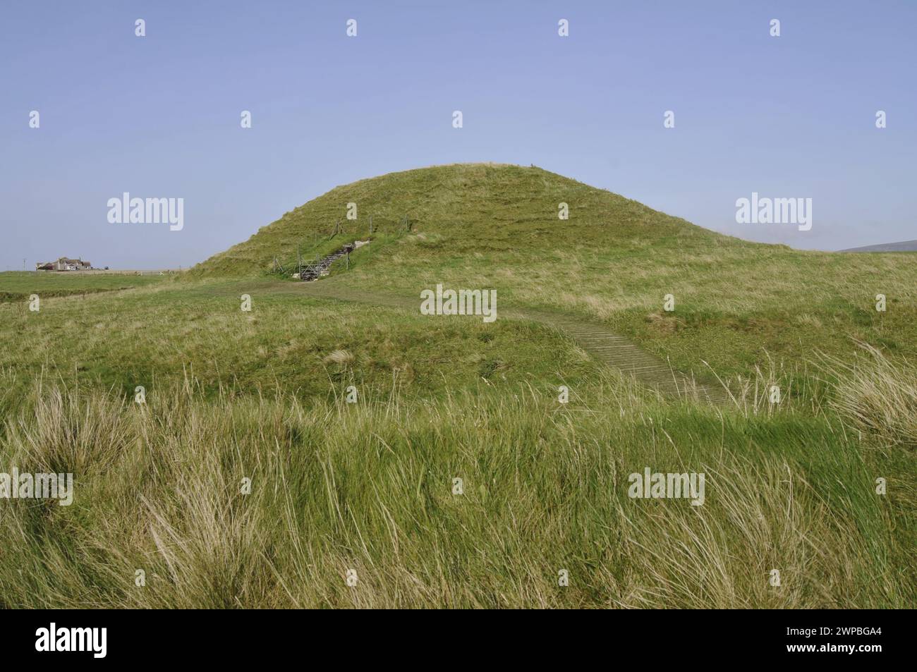 Maeshowe (or Maes Howe; Old Norse: Orkhaugr) is a Neolithic chambered cairn (circa 2800 BC) situated on Mainland Orkney, Scotland, UK Stock Photo