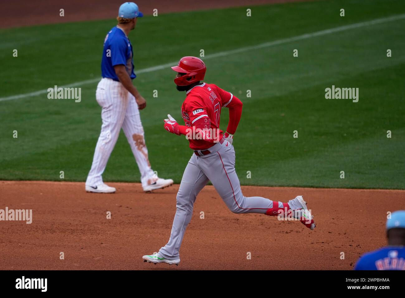 Los Angeles Angels' Jo Adell rounds the bases after hitting a solo home