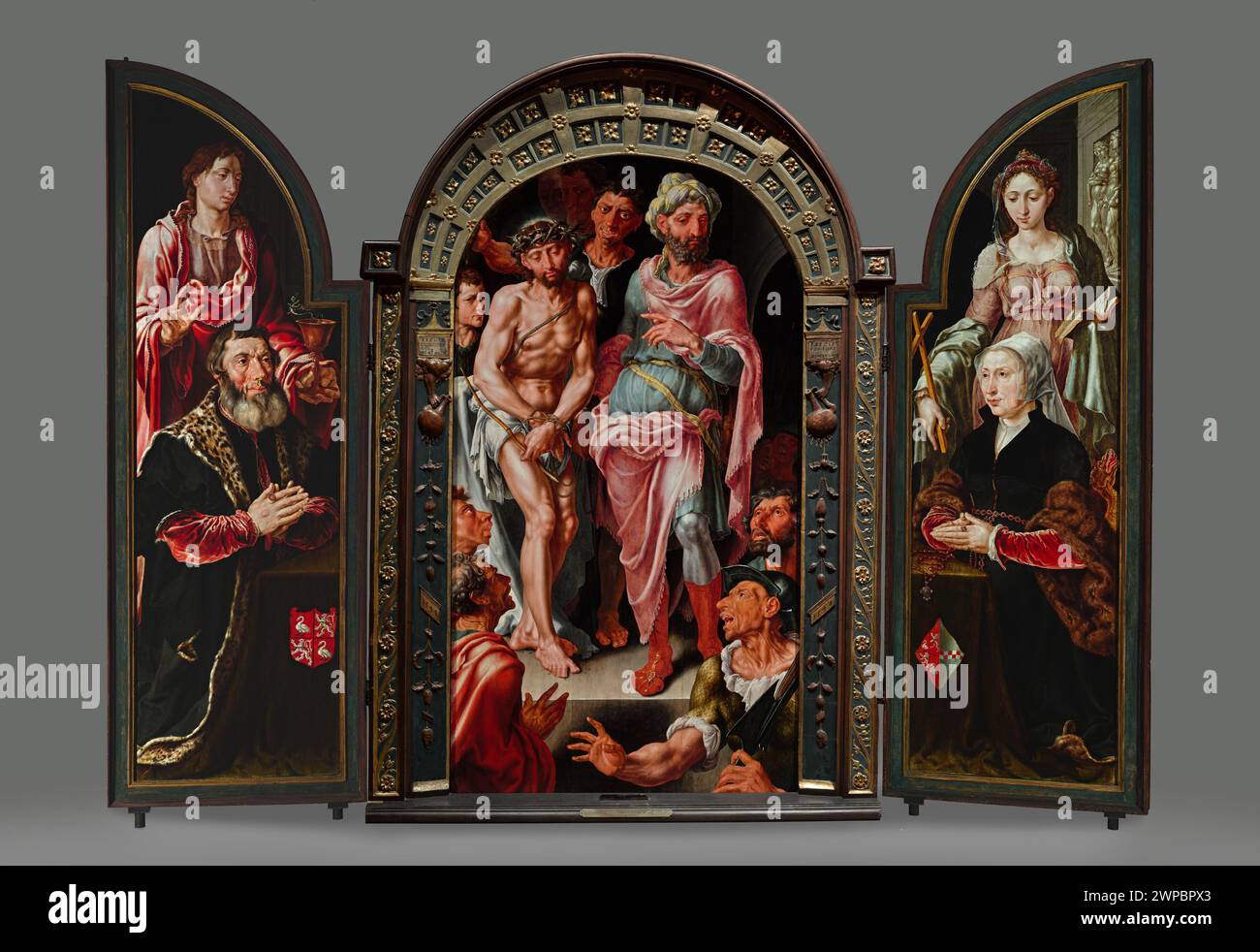 Triptych ecce homo, on wings portraits of donors; Heemskek, Maarten Van (1498-1574); 1544 (1544-00-00-1544-00-00);Ecce Homo (iconogr.), John the Evangelist (Saint -? -A 100), Jan Van Drenckwaerdt (? -1549), Jesus Christ, Margaretha de Jonge van Baertwyck (? -1542), Małgorzata Martynica (Saint -? -? Ca 303–305), Pilate Pontius (prefect Judea - Fl. 26-36/37), Schlesisches Museum der Bildenen Künste (Wrocław - 1880-1945) - collection, cup (attribute), Dutch painting, portraits, portraits, women's portraits, portraits Men's, religious scenes, dragon (attribute), triptych Stock Photo