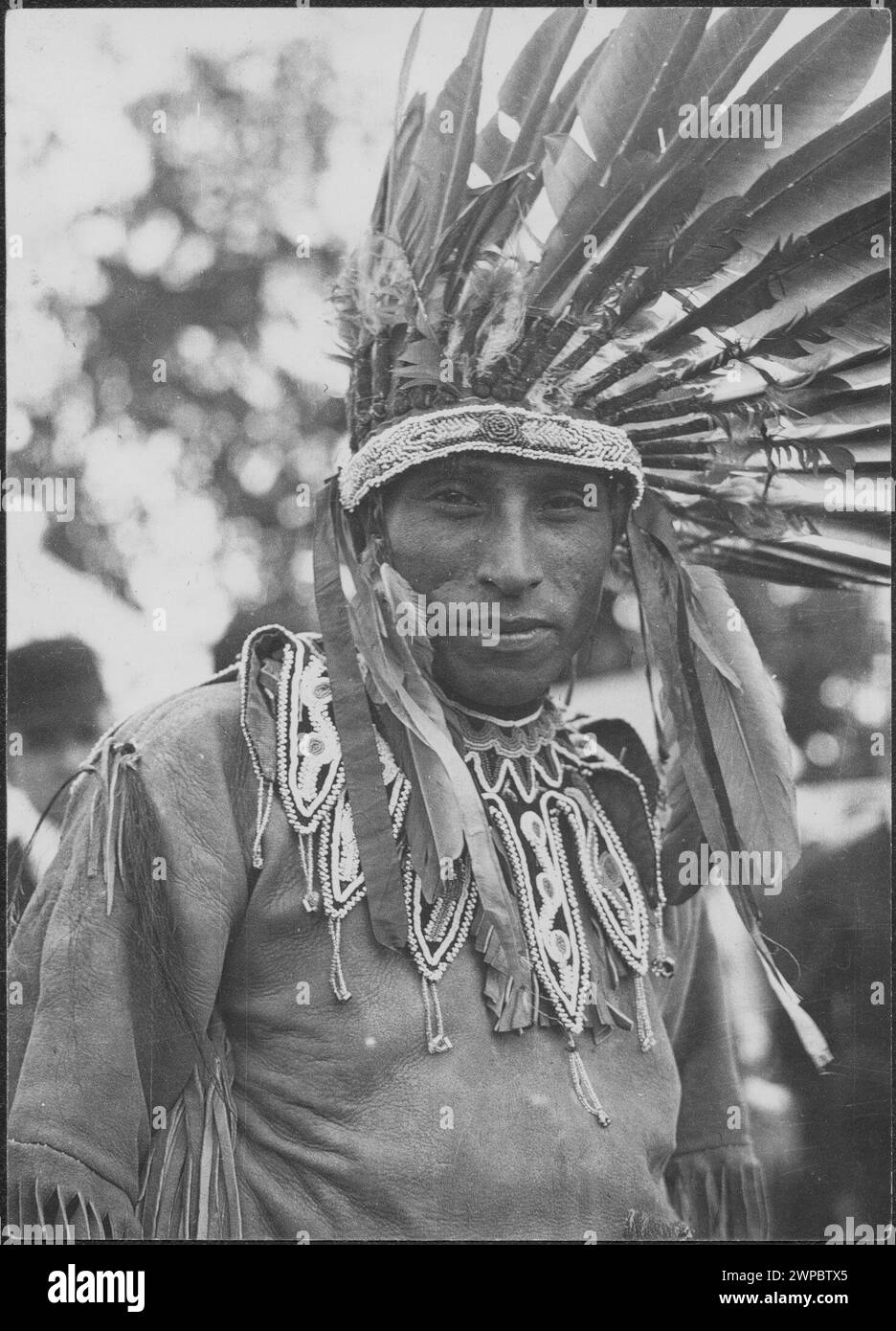 Vintage Historical Portrait Photograph. 'Big Thunder' [Kahnawá:ke Mohawk man photographed wearing regalia and headdress]  1914   Canada. Stock Photo