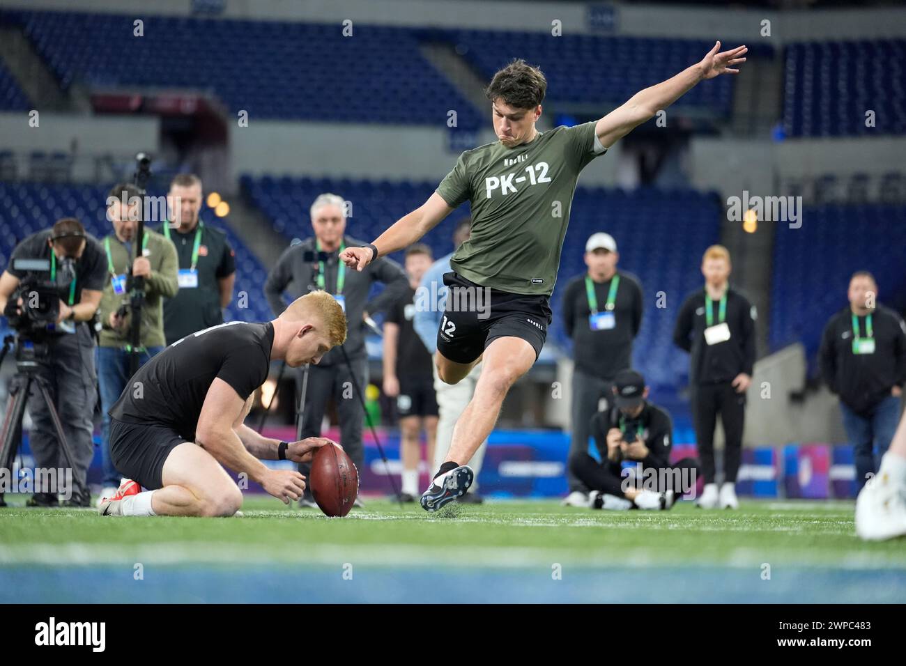 Kicker Charlie Smyth of Ireland runs a drill at the NFL football ...