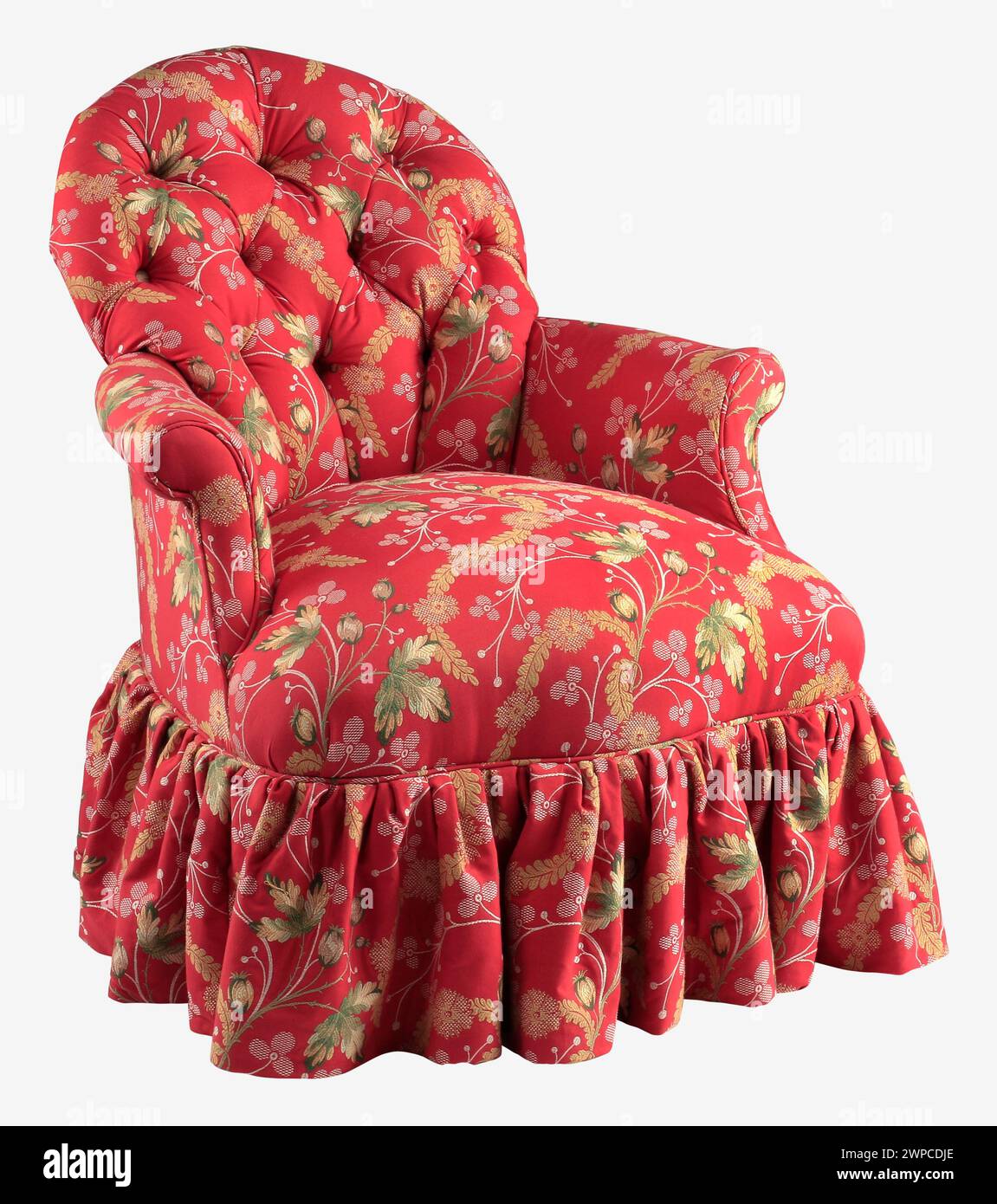 Upholstered arm chair red with skirt with clipping path. Stock Photo