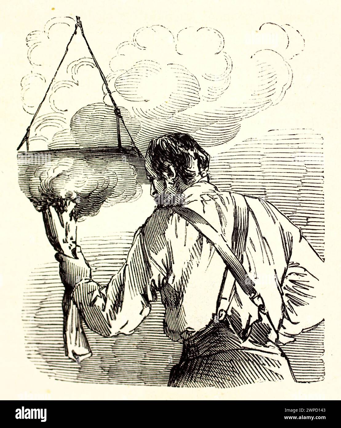 Old engraved illustration of a printmaker heating a metal plate over an open flame during the engraving process. By unknown author, published on 1852 Stock Photo