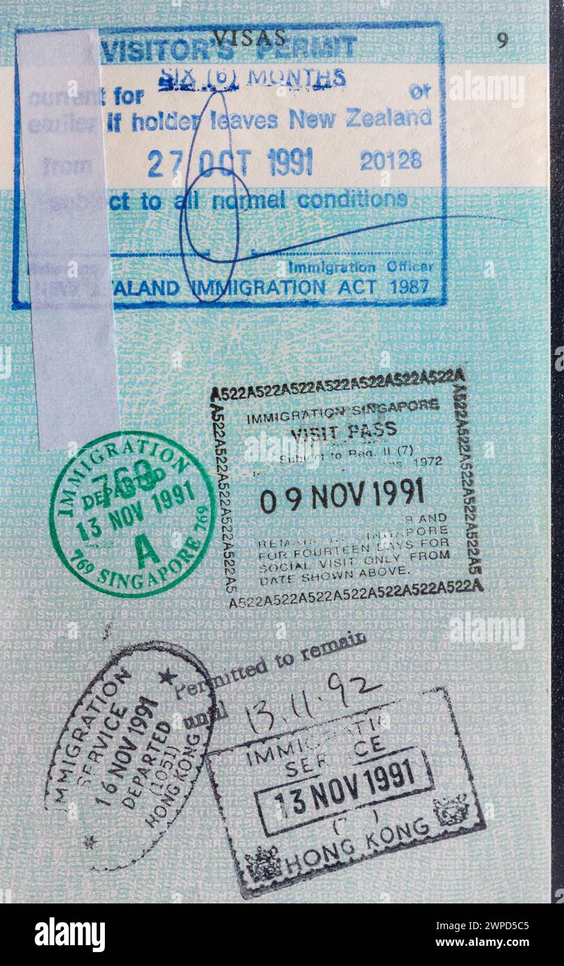 Selection of immigration entry and exit stamps in British passport, from New Zealand, Singapore and Hong Kong Stock Photo