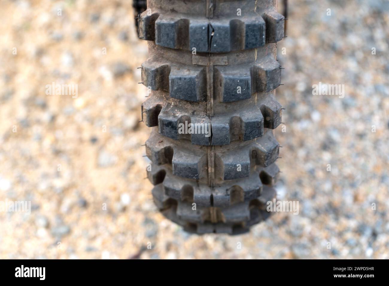 Sand and rubber. Close up of motorcycle tire. Pattern and texture. Stock Photo