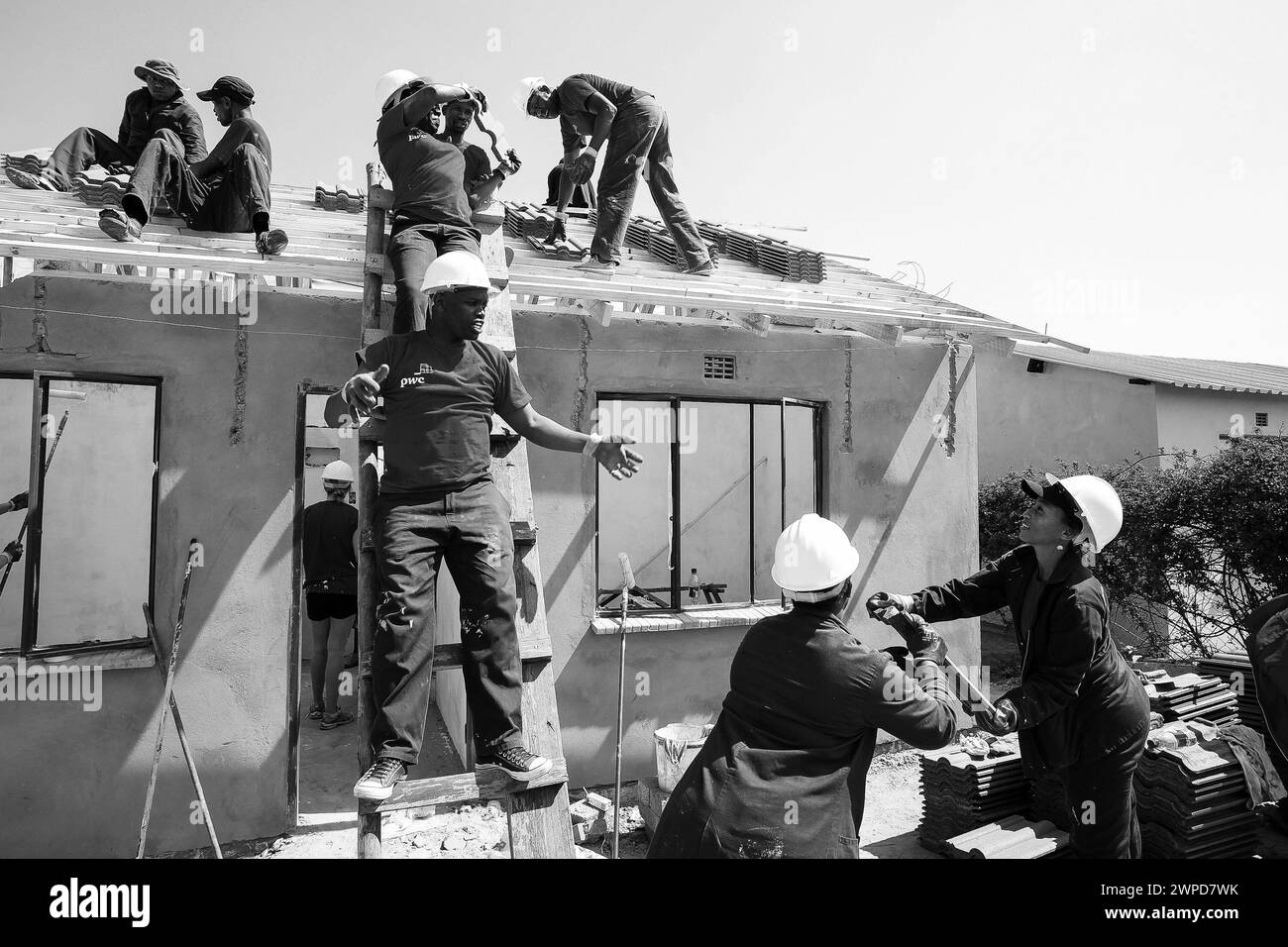 A monochrome shot of construction workers working in Johannesburg, South Africa Stock Photo