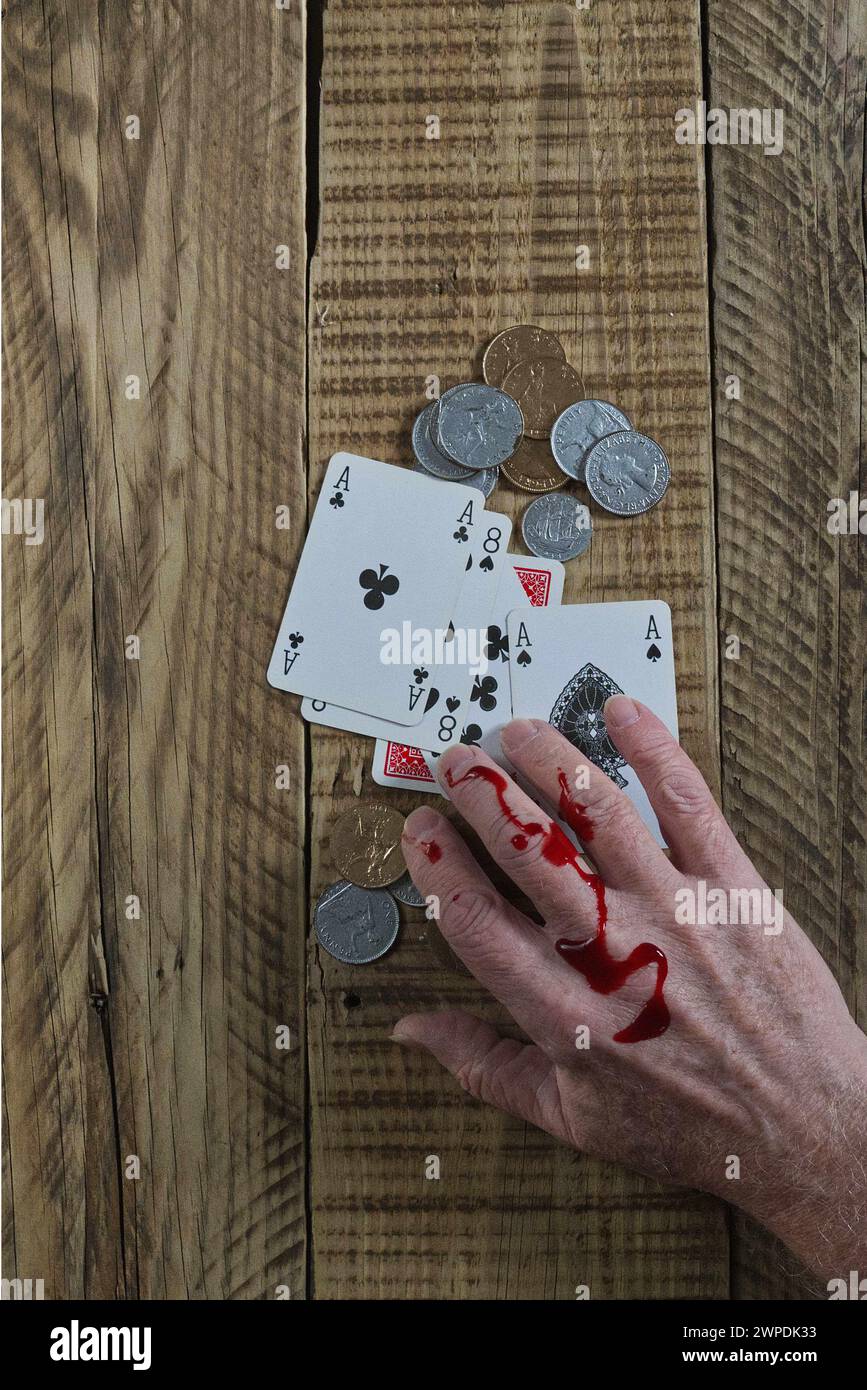 Dead mans hand playing cards aces and eights on wooded background. with ...