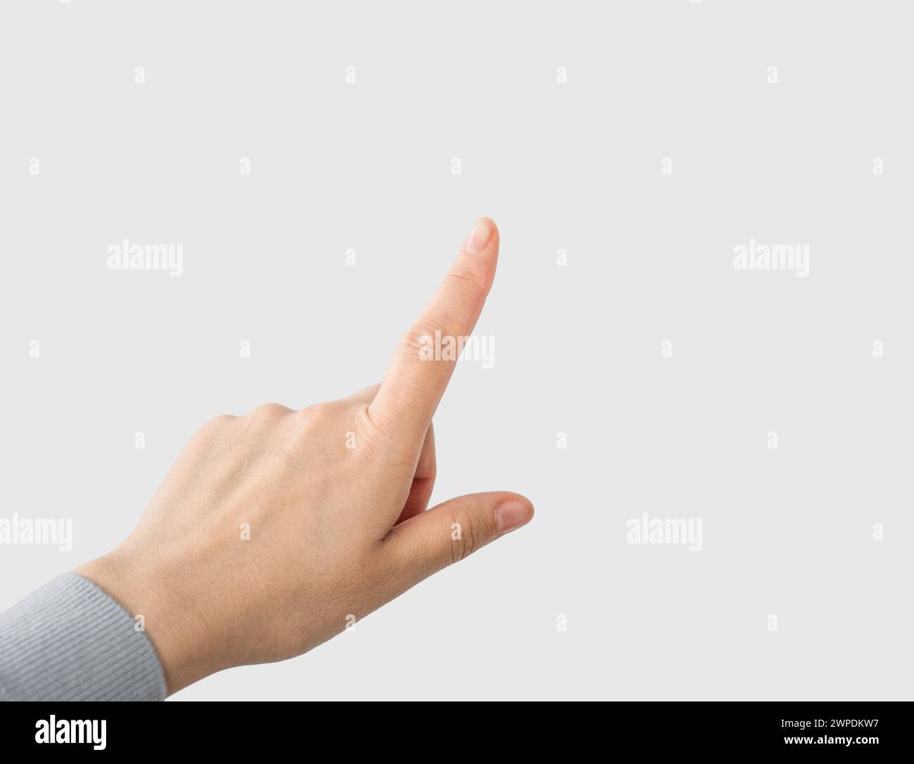 Clicking hand on an empty space. Finger pressing. Copy space to add text or additional content Stock Photo