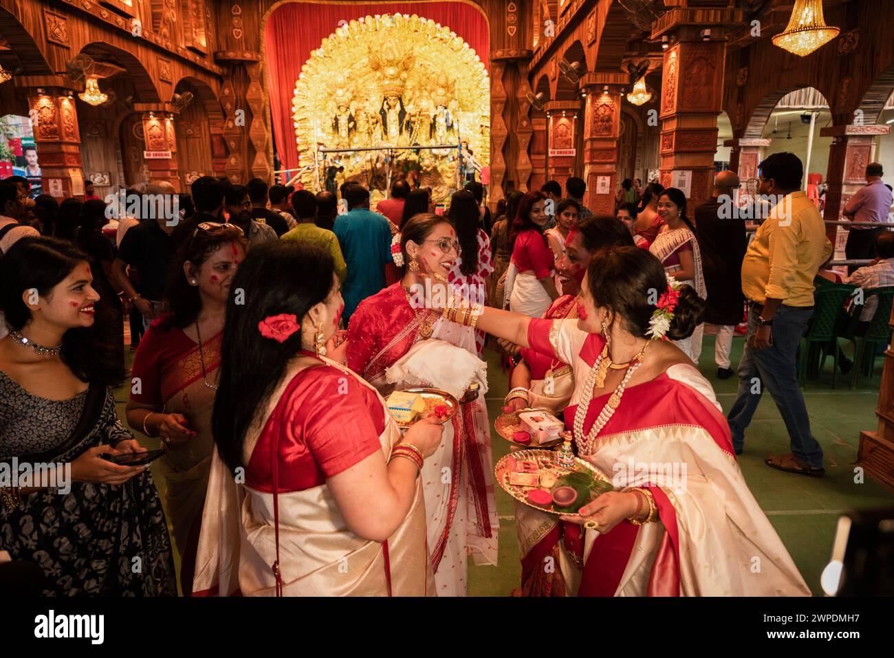"Sindur Khela" is a cherished tradition among Bengali married women, celebrated on the final day of Durga Puja, known as Bijoya Dashami. Stock Photo