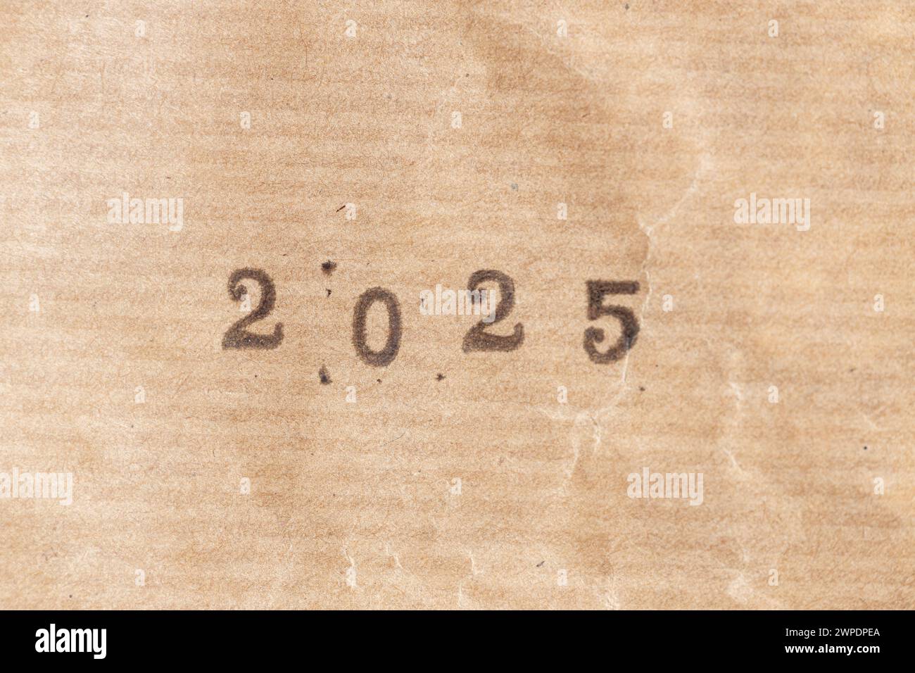 2025 ink rubber stamp on crumpled brown paper Stock Photo Alamy