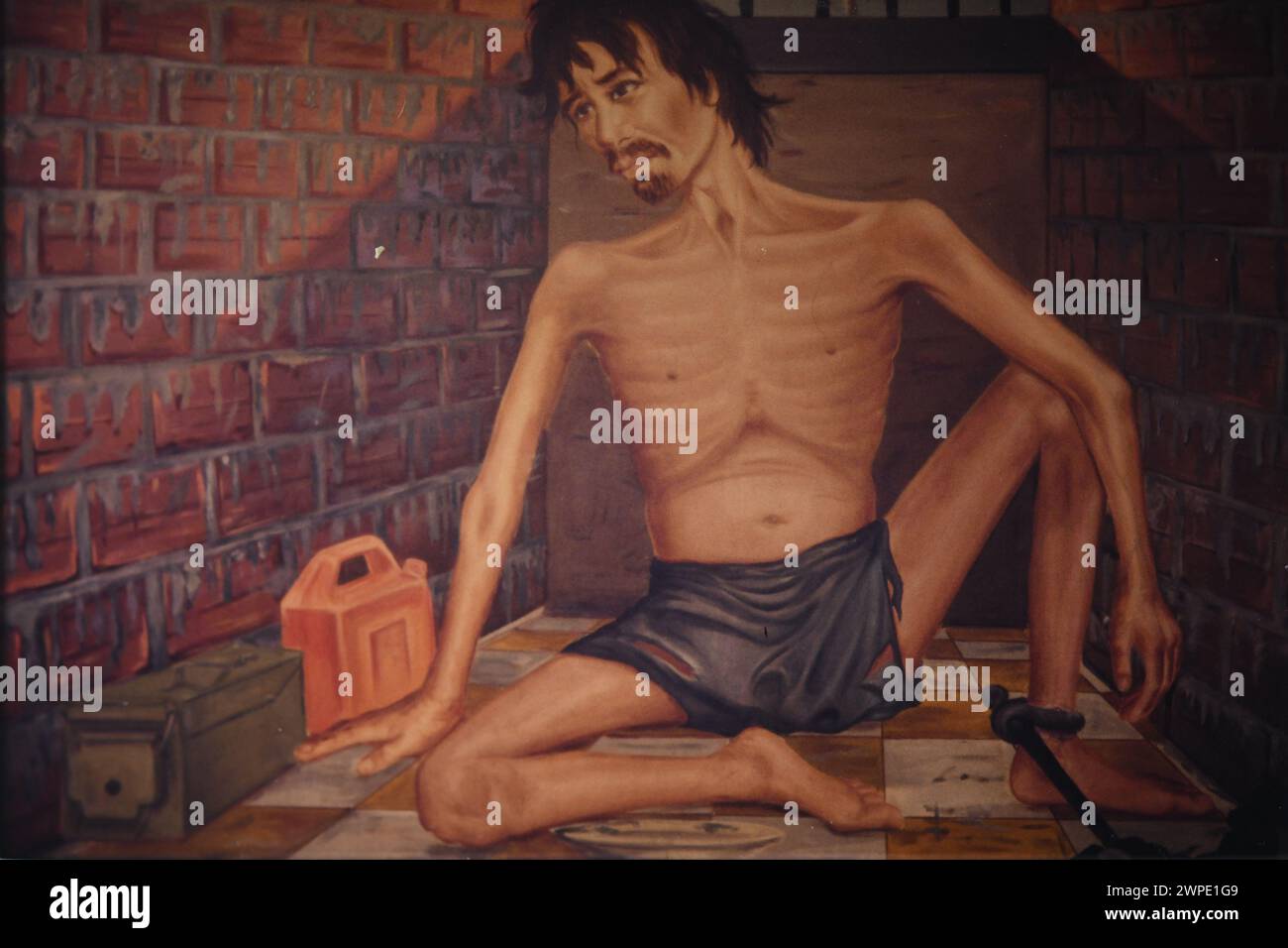 Painting by surviving prisoner of prisoner in tiny cell, taken in 1997, Toul Sleng Genocide Museum; Phnom Penh, Cambodia Stock Photo