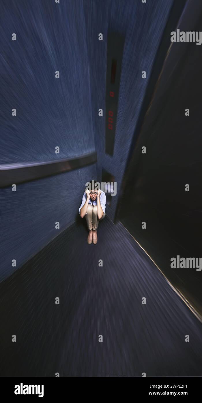 Person, stress and fear elevator with worry for trapped, claustrophobia or anxiety in emergency. Office, lift and woman scared for safety in closed Stock Photo