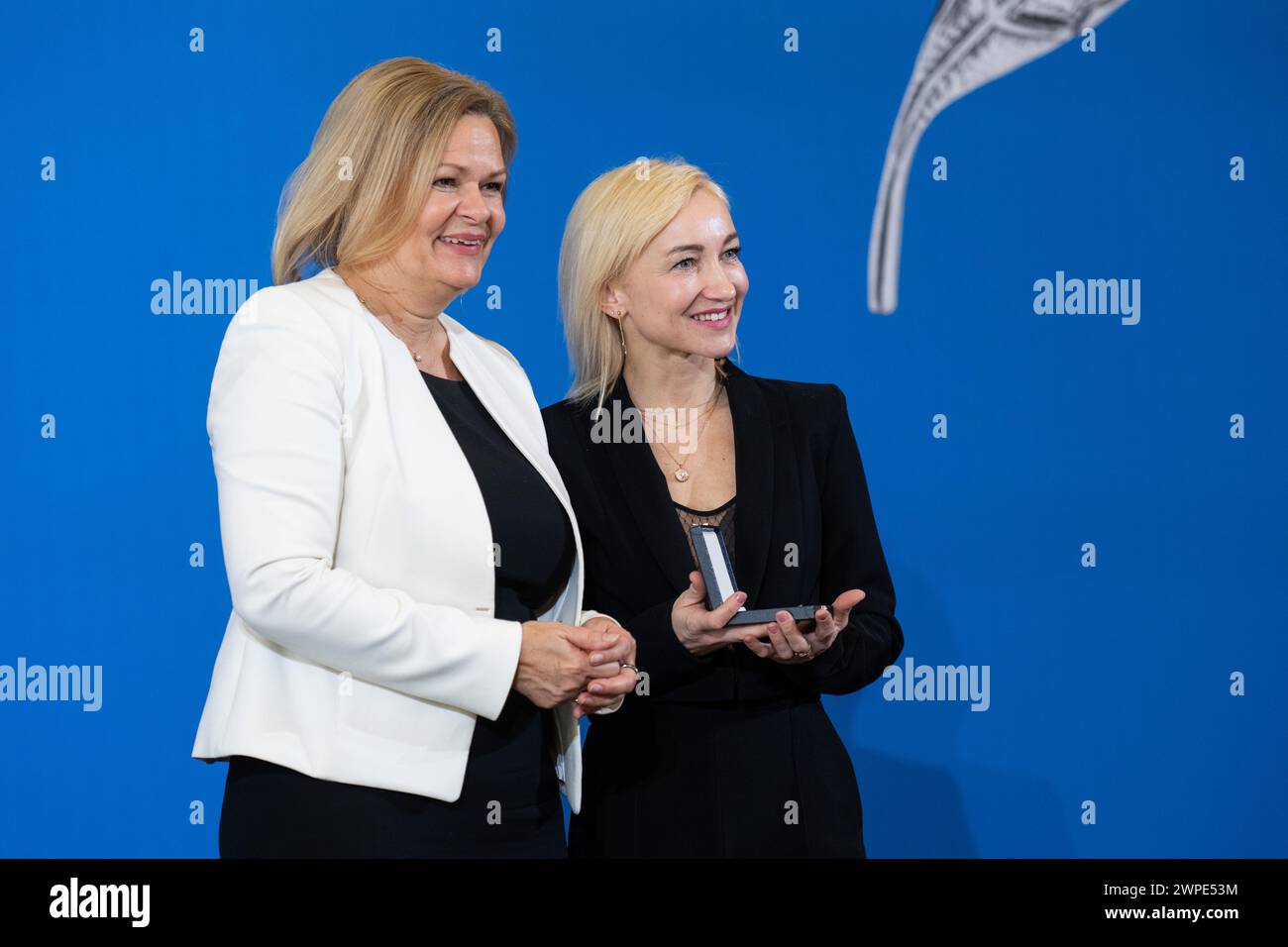Berlin, Germany. 07th Mar, 2024. Nancy Faeser (SPD, l), Federal Minister of the Interior and Home Affairs, presents Aljona Savchenko, figure skater, with the Silver Laurel Leaf. The Silver Laurel Leaf is Germany's highest state award for success in sport. Credit: Christophe Gateau/dpa/Alamy Live News Stock Photo