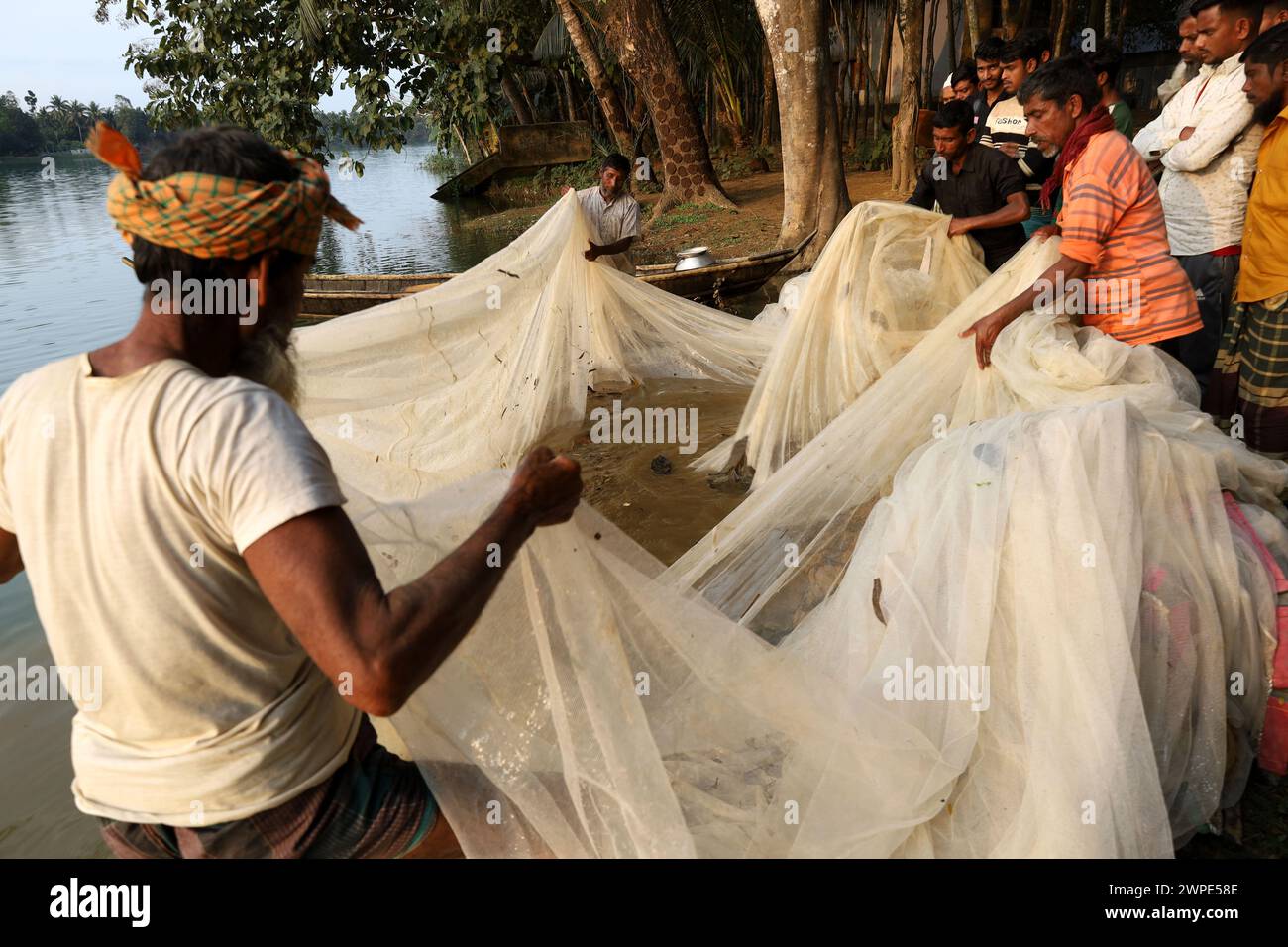 March 7, 2024, Sherpur, Sherpur, Bangladesh Fishermen are pulling a