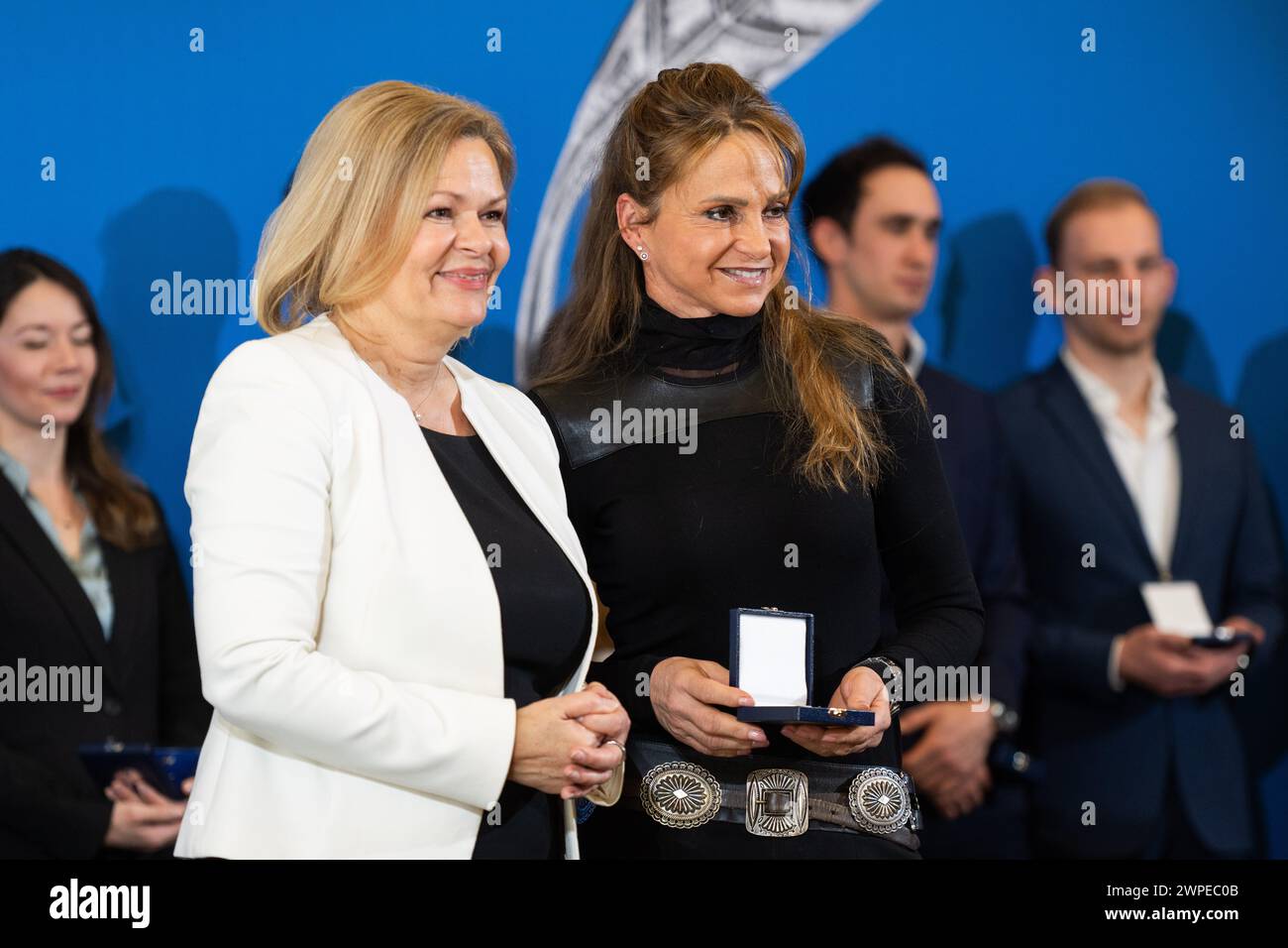 Berlin, Germany. 07th Mar, 2024. Nancy Faeser (SPD, l), Federal Minister of the Interior and Home Affairs, presents Dorothee Schneider, dressage rider, with the Silver Laurel Leaf. The Silver Laurel Leaf is Germany's highest state award for success in sport. Credit: Christophe Gateau/dpa/Alamy Live News Stock Photo