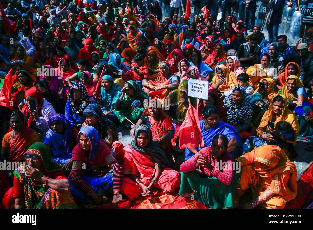 Kathmandu, Nepal. 07th Mar, 2024. Victims of loan sharking sit on the streets during a protest demanding justice after 38 days of protest in Kathmandu. Despite government promises, they're still trapped in debt, facing high-interest rates and coercion. Credit: SOPA Images Limited/Alamy Live News Stock Photo