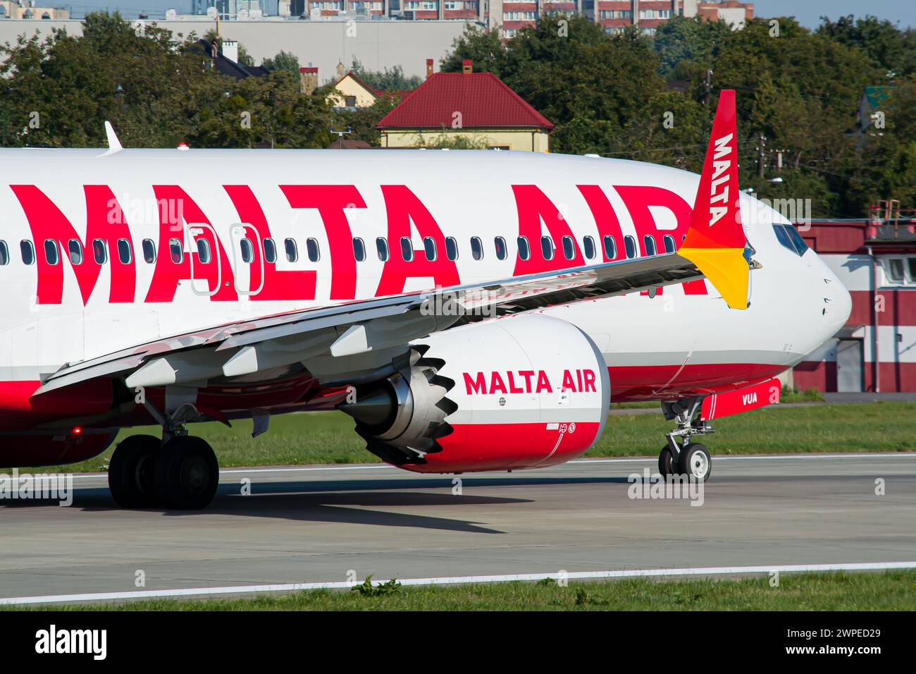 Close-up of a low-cost airline's Malta Air Boeing 737 MAX 8-200 taxiing for takeoff in Lviv Airport Stock Photo