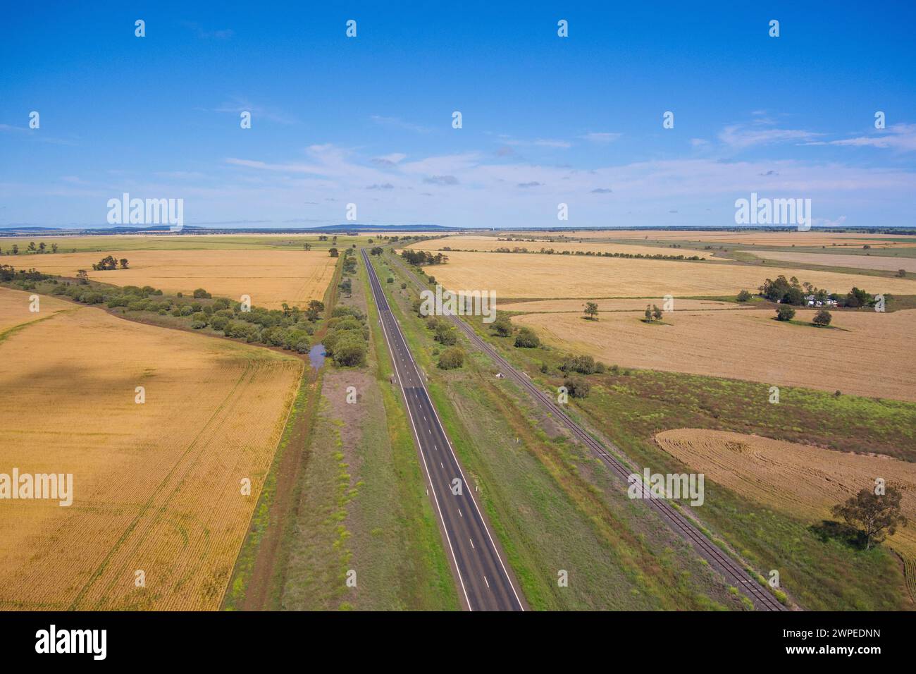 Aerial of wheat grain fields surrounding the Warrego Highway near Muckadilla Queensland Australia Stock Photo