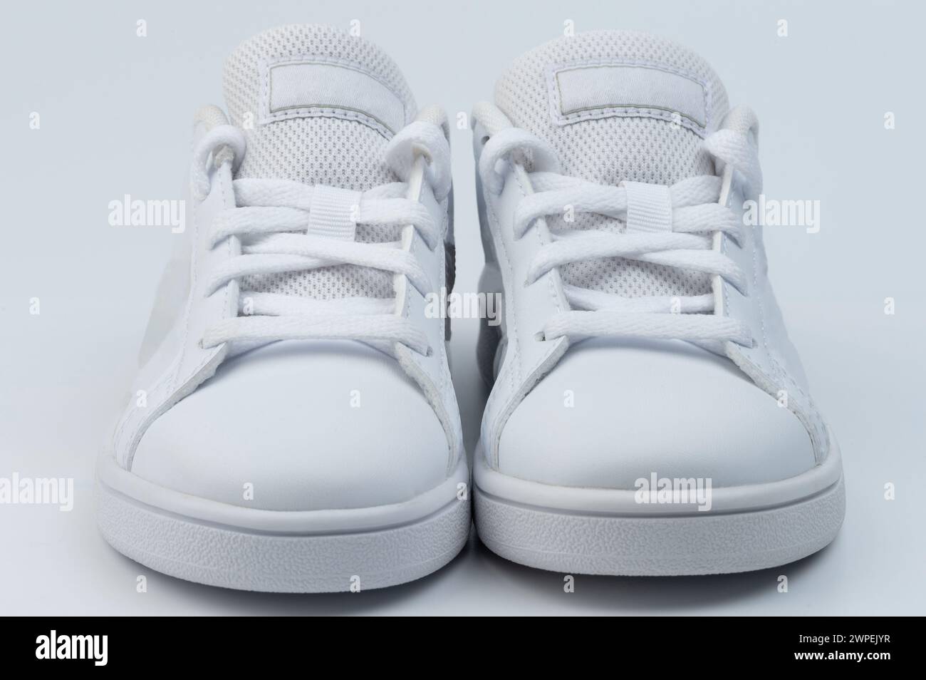 White shoes with pair with laces front view isolated Stock Photo