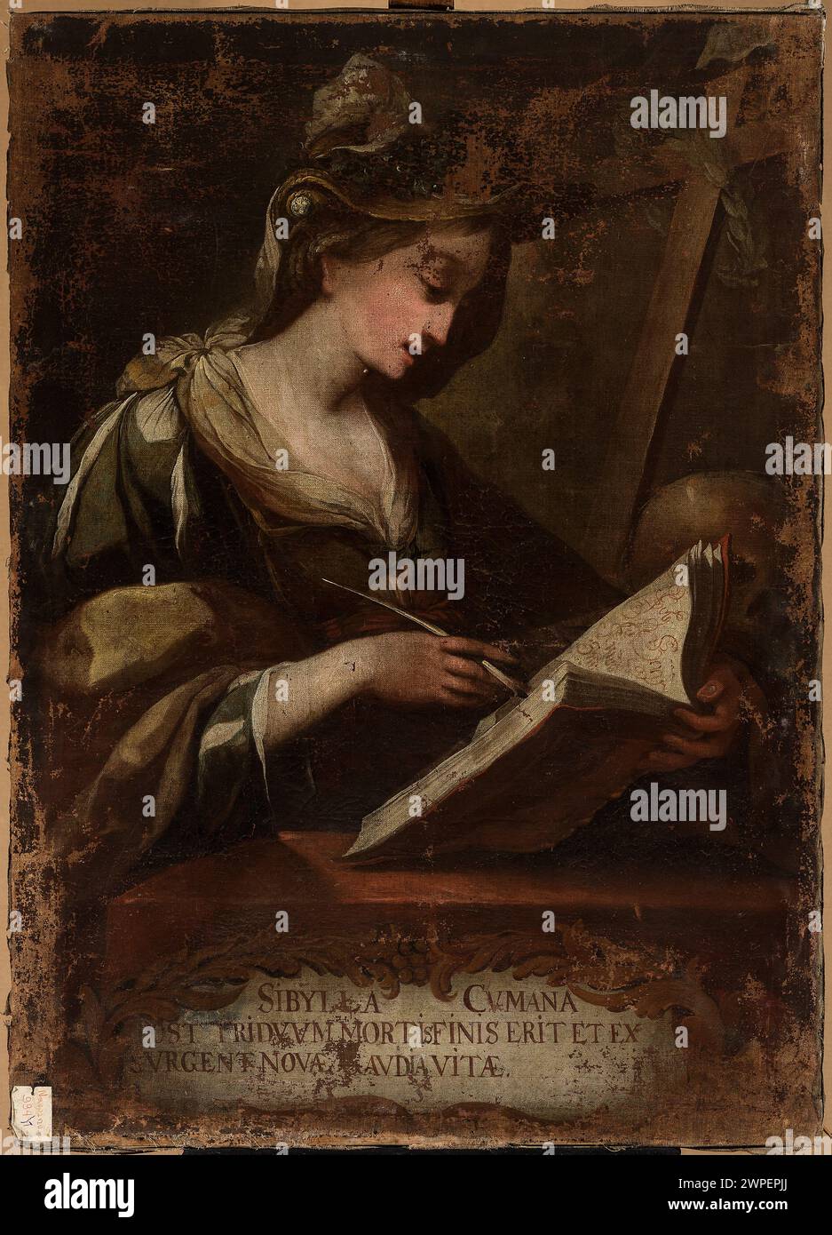 This 18th-century Silesian painting depicts Sybilla Cuman with skulls, crosses, open books, and laurel wreaths, combining religious and symbolic elements. Stock Photo