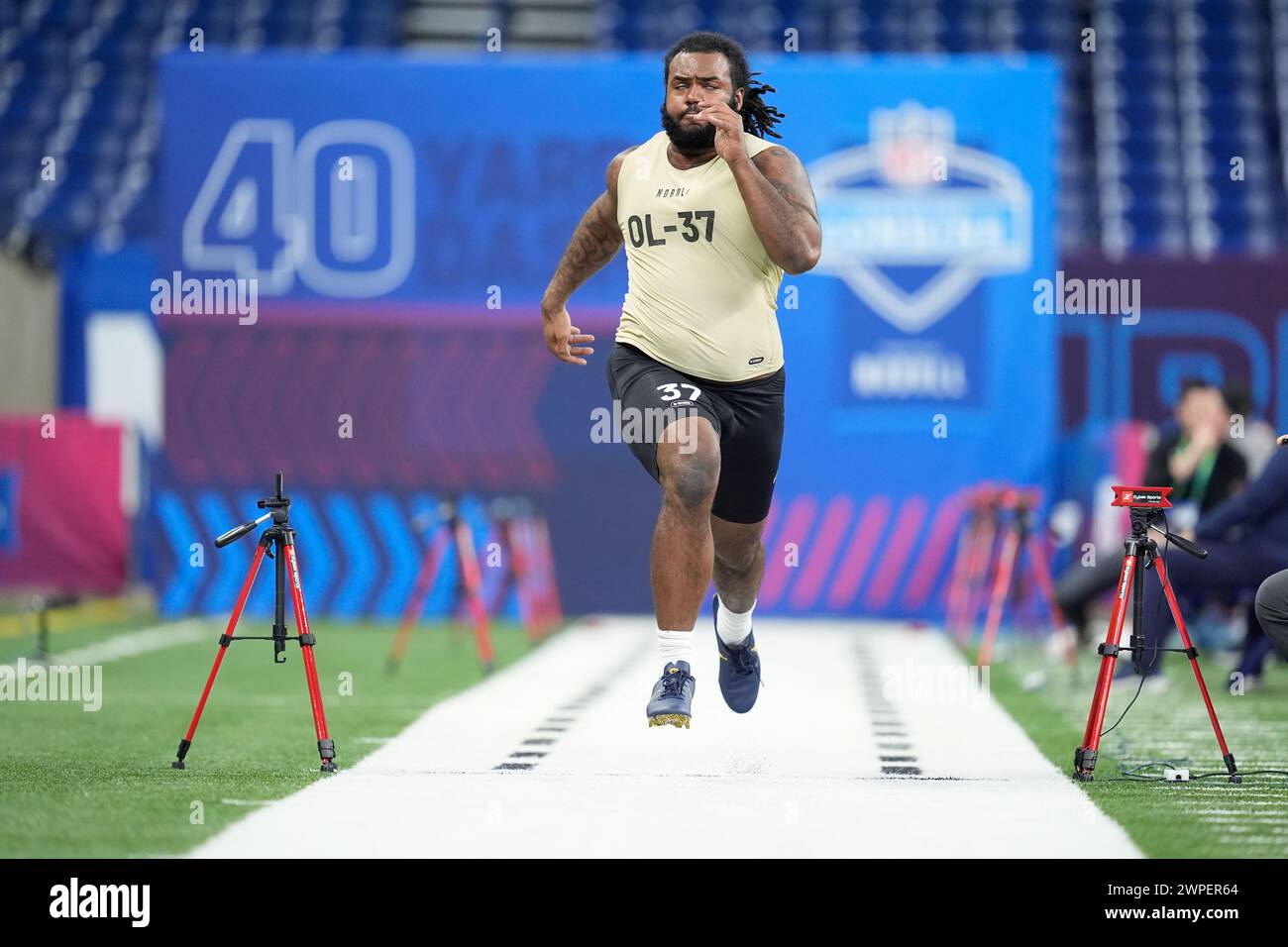 Michigan offensive lineman Trente Jones runs the 40yard dash at the NFL football scouting