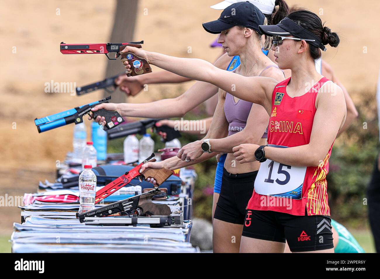 Cairo, Egypt. 7th Mar, 2024. Zhang Mingyu (front) of China competes in ...